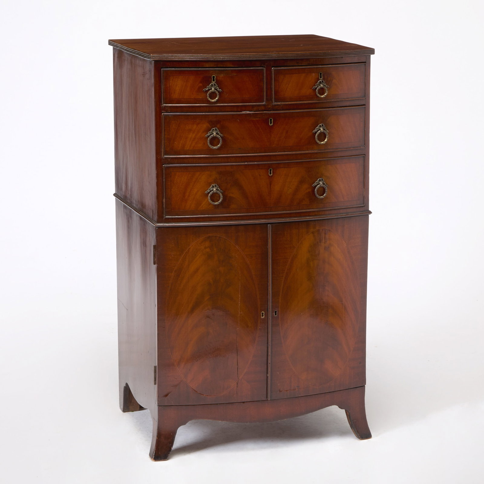 George III Style Mahogany Bowfront Cabinet: Early 20th century Height 42 inches, width 24 inches, depth 20 1/4 inches. scratches and marks to top; cracks to drawer fronts and doors; edgewear to legs