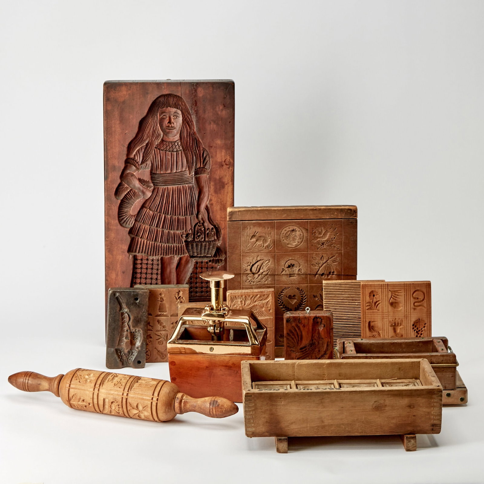 Group of Mostly Wooden Cookie Stamps and Molds: Mostly 19th century Height of box 3 3/4 inches, width 11 inches.