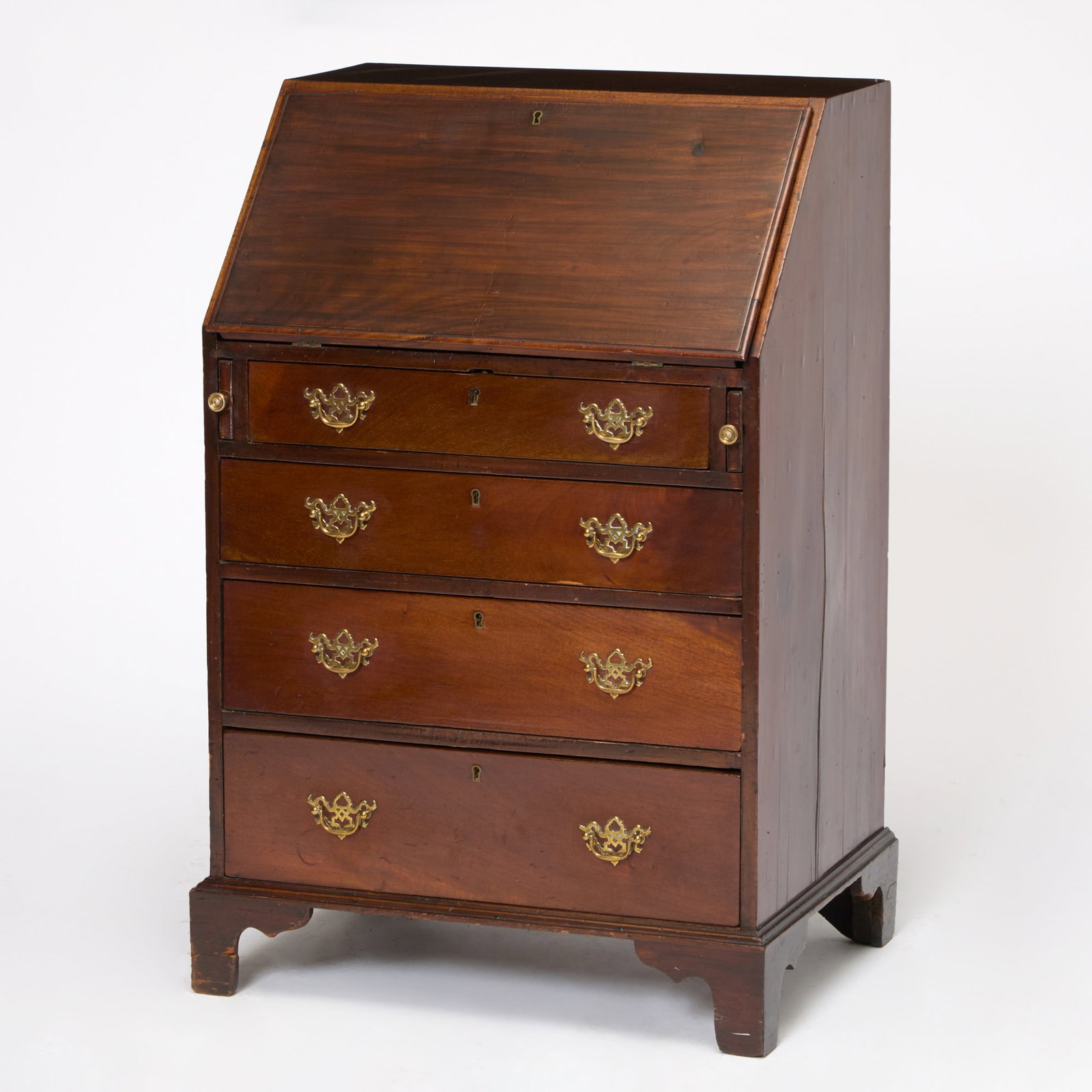 Chippendale Style Mahogany Slant Front Desk: Early 20th century With four graduated drawers on a bracket base. Height 37 inches, width 24 inches, depth 18 inches.