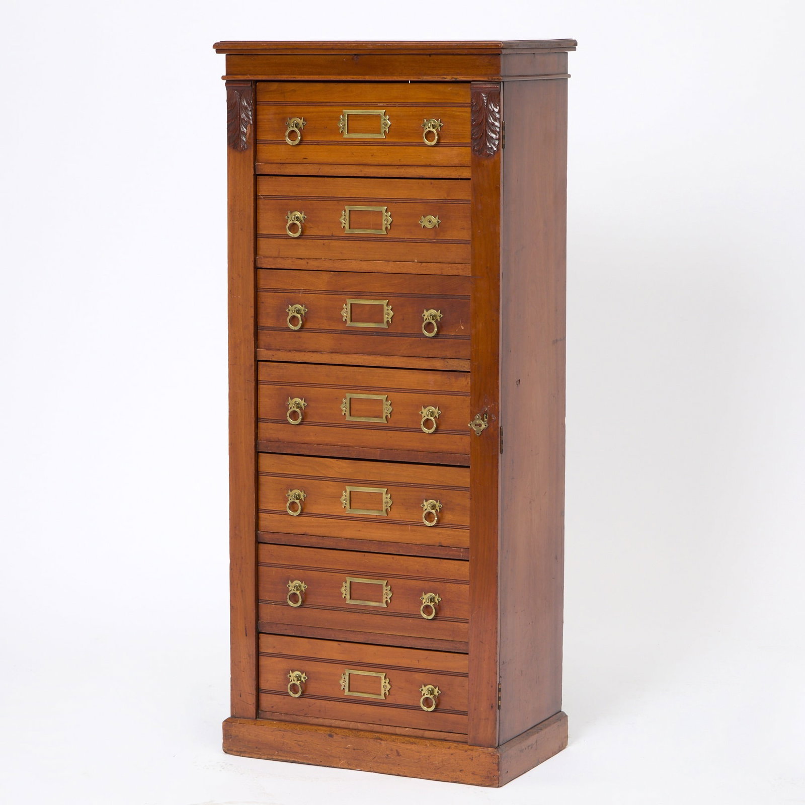 Victorian Mahogany Wellington Chest: Late 19th century The seven graduated drawers have brass handles and nameplates with scribed detail to the drawer fronts. Height 57 1/2 inches, width 25 inches, depth 14 1/2 inches. Some wear
