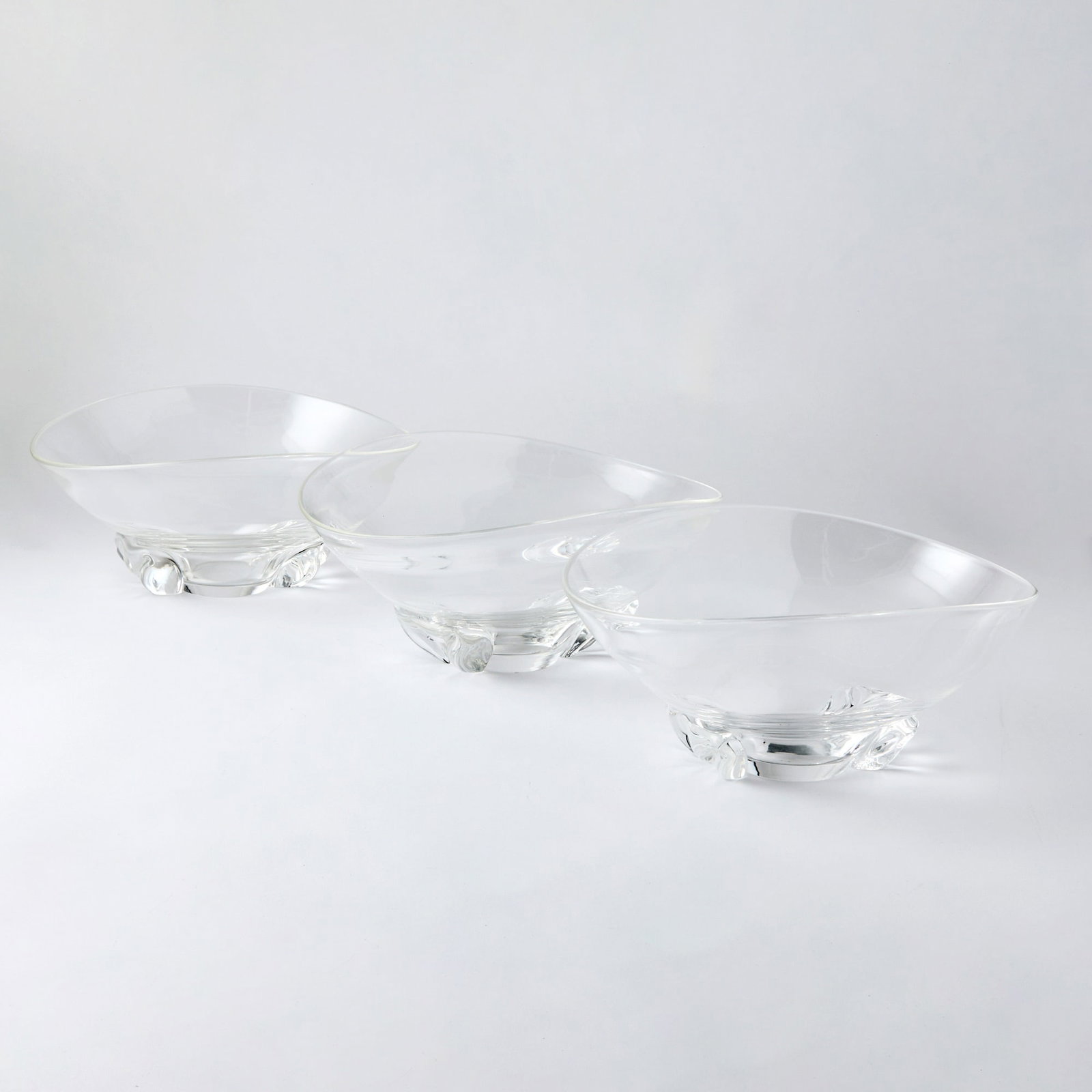 Group of Three Steuben Glass Bowls: Height of largest 4 1/2 inches, width 11 3/4 inches. generally good condition