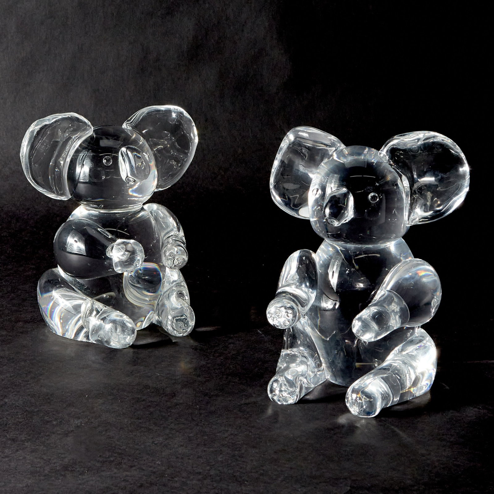 Pair of Steuben Glass Koalas: Designed by Lloyd Atkins Height 8 3/4 inches.