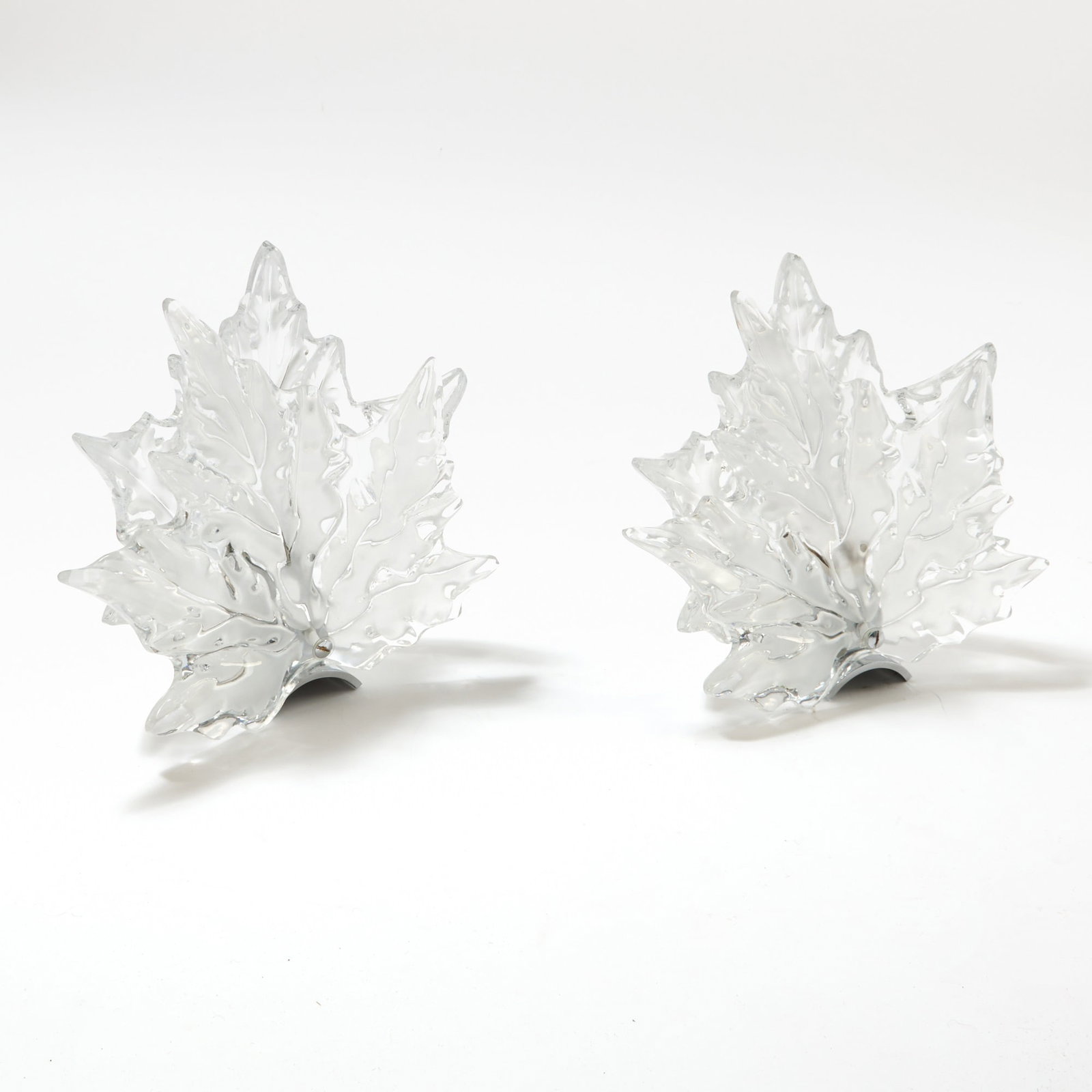 Assembled Pair of Lalique Molded Glass Champs Elysées Single-Light Wall Sconces Second half: Each upright leaf-form diffuser in colorless glass, with a glossy and satin finish, signed Lalique France with the "R" registry symbol. One with chromed metal backplate. Height of largest diffuser 10