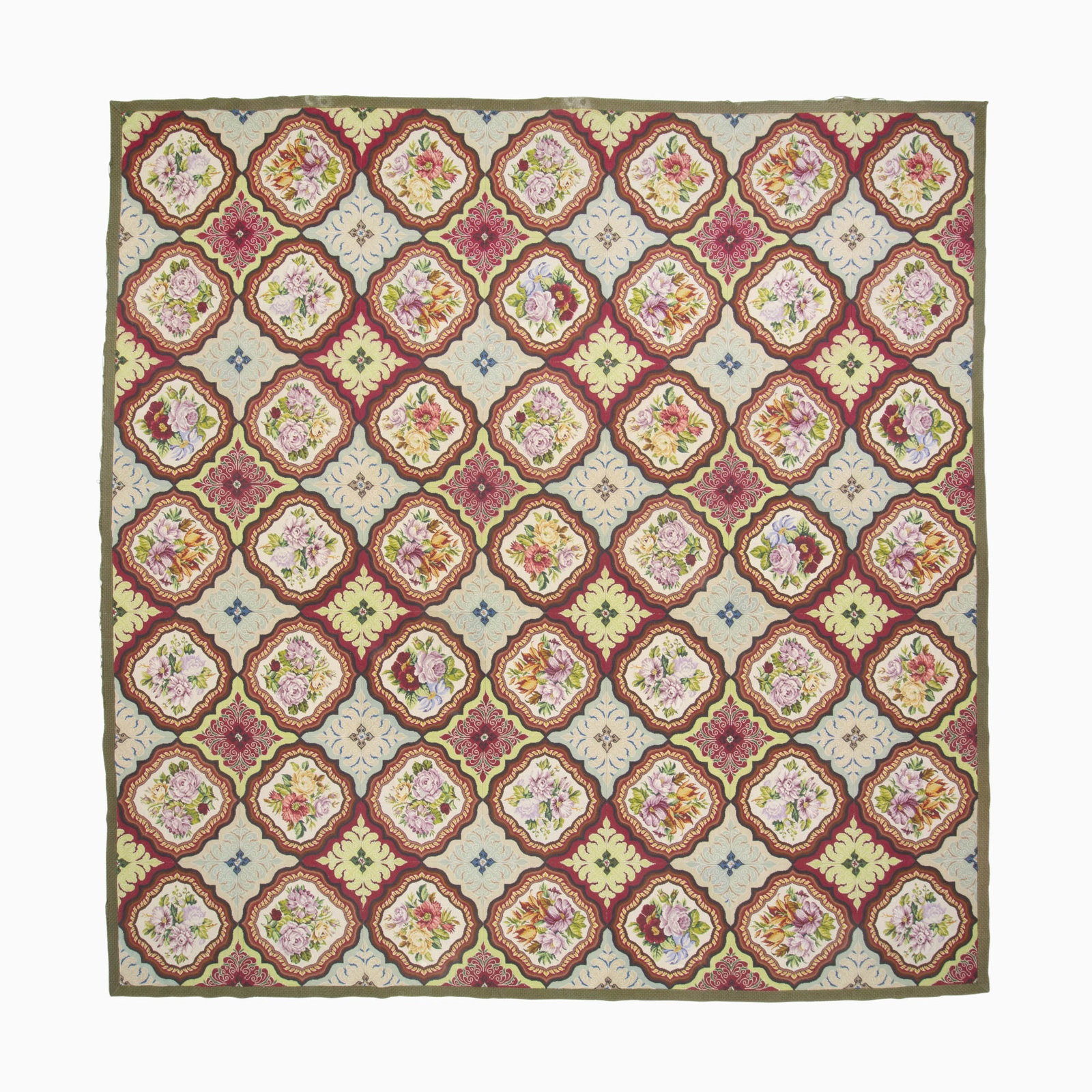 French Needlepoint Carpet: France, Late 19th Century Having an overall pattern of polychrome sprays and floral medallions within an olive-green outer stripe border. (12' 0" x 11' 10") Minor color runs, outer guard stripe