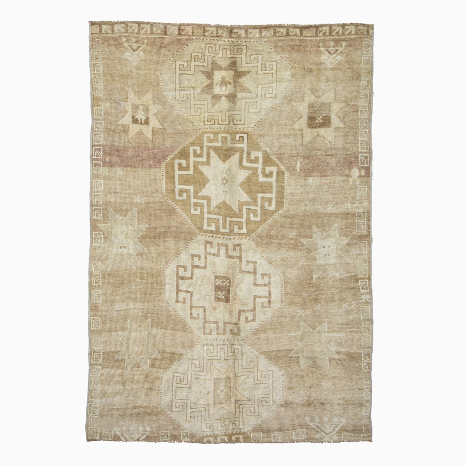 Kars Carpet: East Turkey, mid-20th century Having four octagonal medallions flanked by stylized rosettes on a camel field. (8' 10" x 6' 0") Restorations, areas of wear, chemically washed, losses to one end