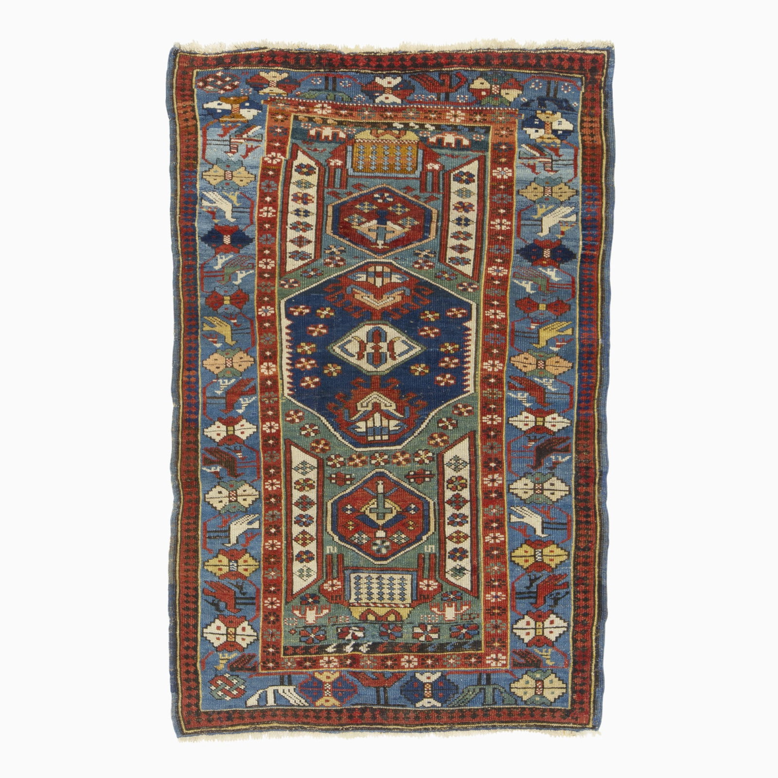 Seychour Rug: Northeast Caucasus, Circa 1900 Three hexagonal medallions on the sage field are within an indigo rosette and bird border. (4' 10" x 3' 1") Re-piled and restored areas