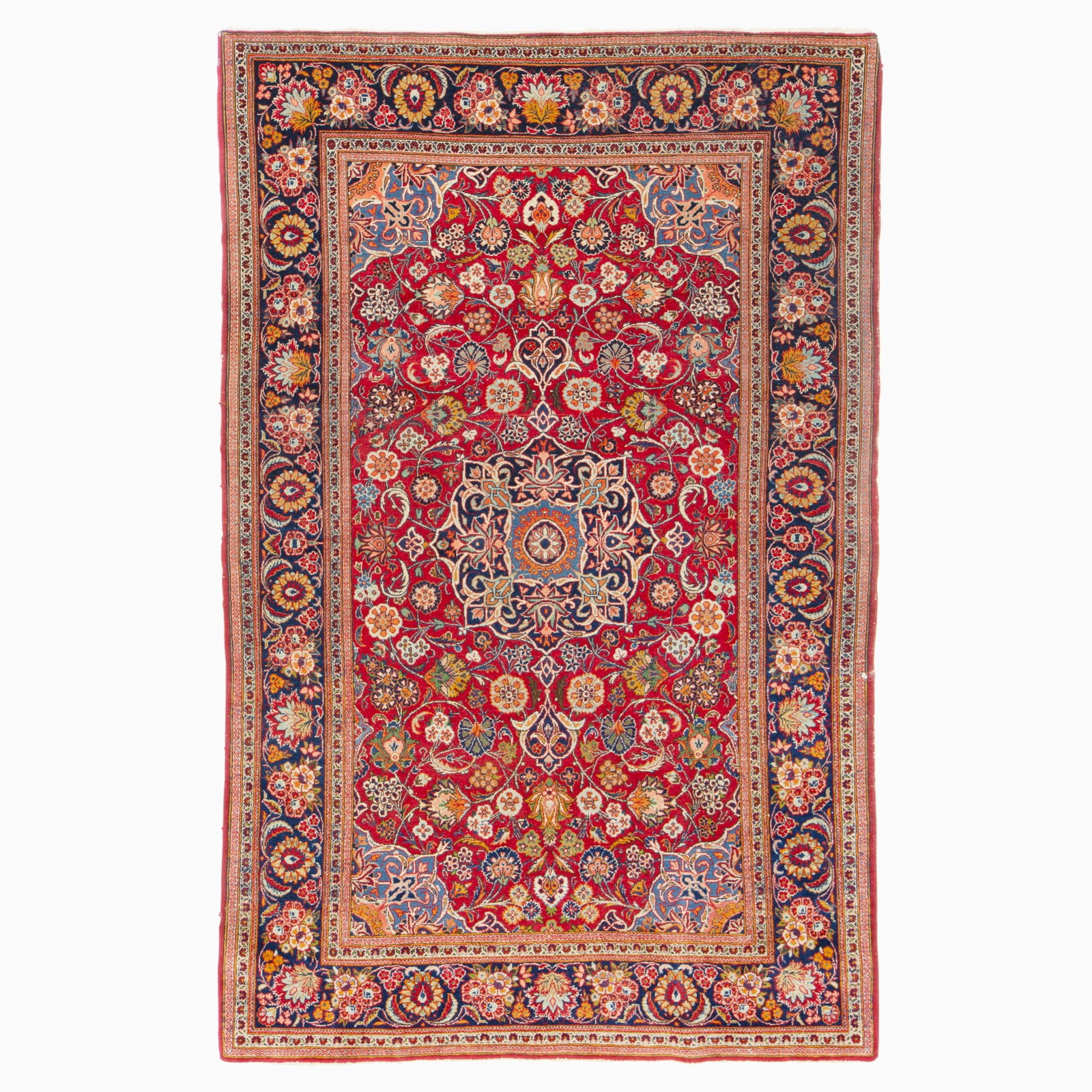 Kashan Rug: Central Persia, Mid-20th Century The central pendant medallion on the crimson field flanked by complementary spandrels is within an indigo palmette and leafy vine border. (6' 9" x 4' 4") Small breaks