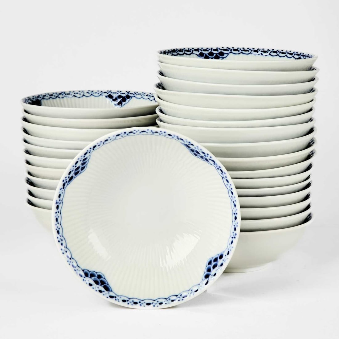 Set of Twenty-Eight Royal Copenhagen Porcelain "Princess" Pattern Bowls: Height 2 1/8 inches, diameter 6 1/8 inches. (28)