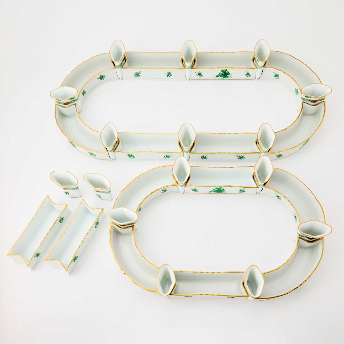 Herend Porcelain "Chinese Bouquet Green" Pattern Surtout-de-Table: Comprising sixteen curved and rectangular elements, length of longest rectangular element 6 3/4 inches; and sixteen bud vases, height 2 3/4 inches, width 2 3/4 inches. (32)