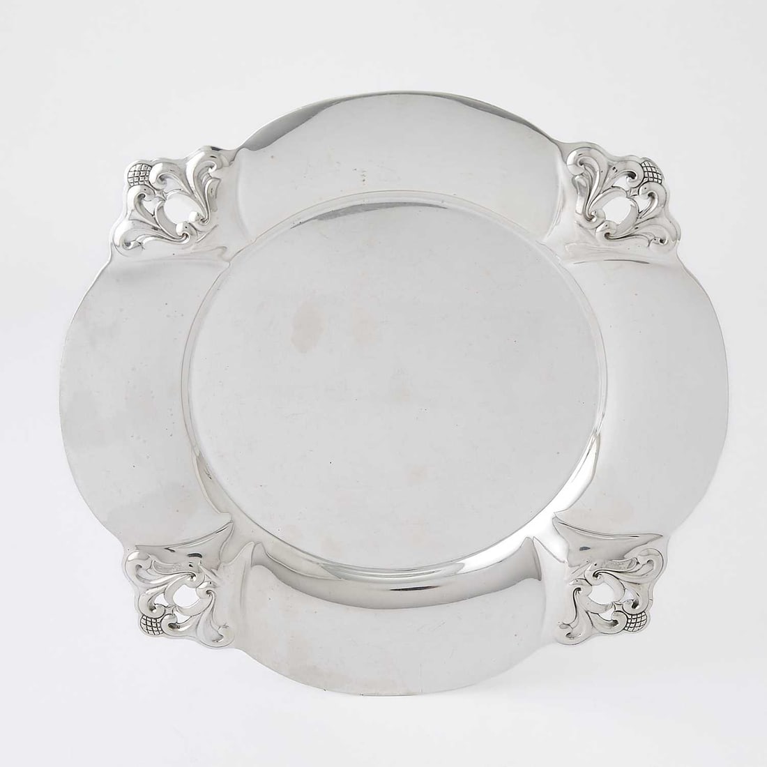 International Silver Co. Sterling Silver "Royal Danish" Pattern Dish: Mid 20th century Diameter 11 3/4 inches, approximately 20 ounces. Generally good condition overall with light surface markings from normal use; some bending to tips of decoration