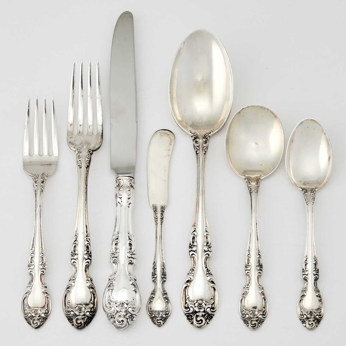 Gorham Sterling Silver "Melrose" Pattern Flatware Service: Comprising: Twelve dinner forks Twelve salad forks Twelve dinner knives Twelve butter knives Twelve round soup spoons Twenty-four teaspoons Salad serving fork and spoon Four serving spoons Gravy ladle