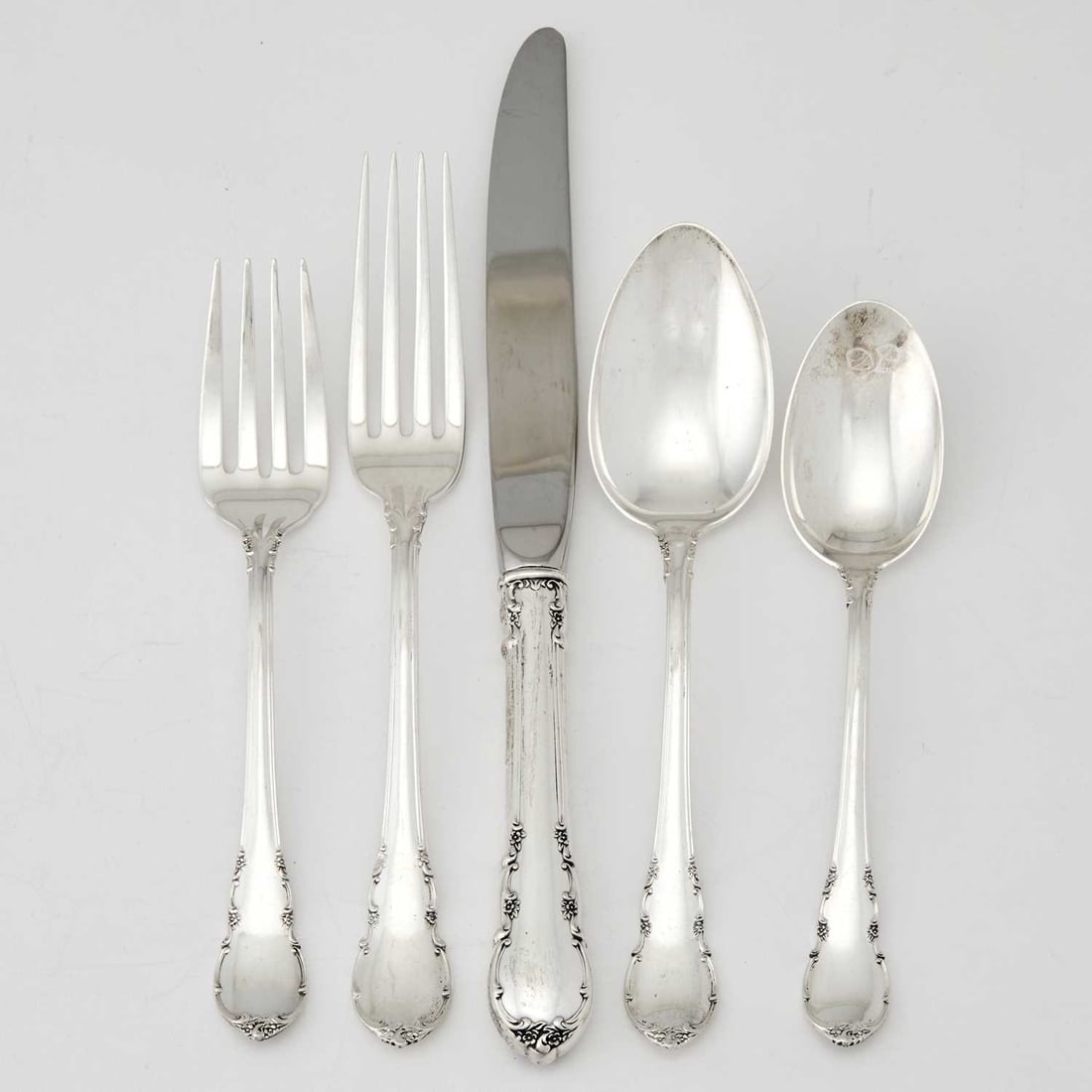 Lunt Sterling Silver "Modern Victorian" Pattern Flatware Service: Comprising: Twelve dinner forks Twelve salad forks Twelve dinner knives Twelve butter knives Twelve dessert spoons Twelve teaspoons Two serving spoons Pierce serving spoon Gravy ladle Sauce ladle