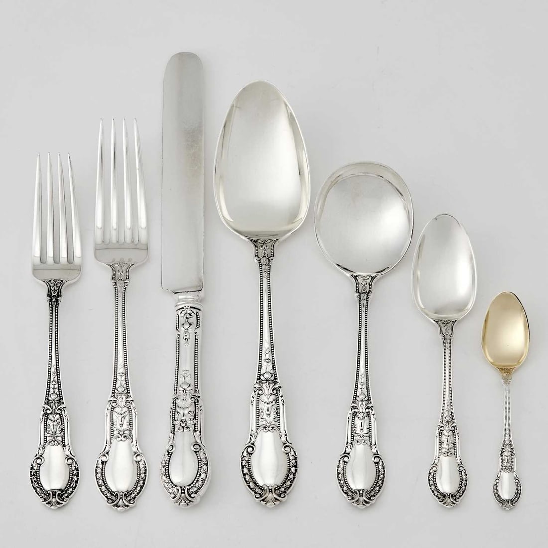 Gorham Sterling Silver "Tuileries" Pattern Part Flatware Service: Comprising: Twelve dinner forks Nine lunch forks Nine dinner knives Twelve tablespoons Twelve round soup spoons Twelve teaspoons Twelve demitasse spoons Cake server Master butter knife Sugar spoon