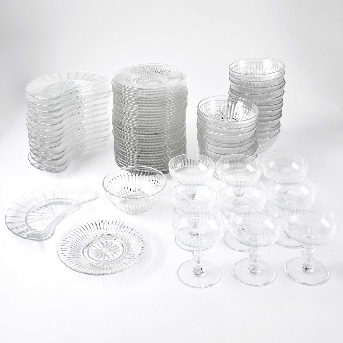 Set of Thirty-Six Molded Glass Bowls and Underplates: Made in Malaysia, in colorless glass, height of bowl 2 1/4 inches, diameter 5 1/2 inches; diameter of underplate 7 inches; Together With a Set of Twenty-Two Molded Glass Crescent-Shaped Side Plates, i