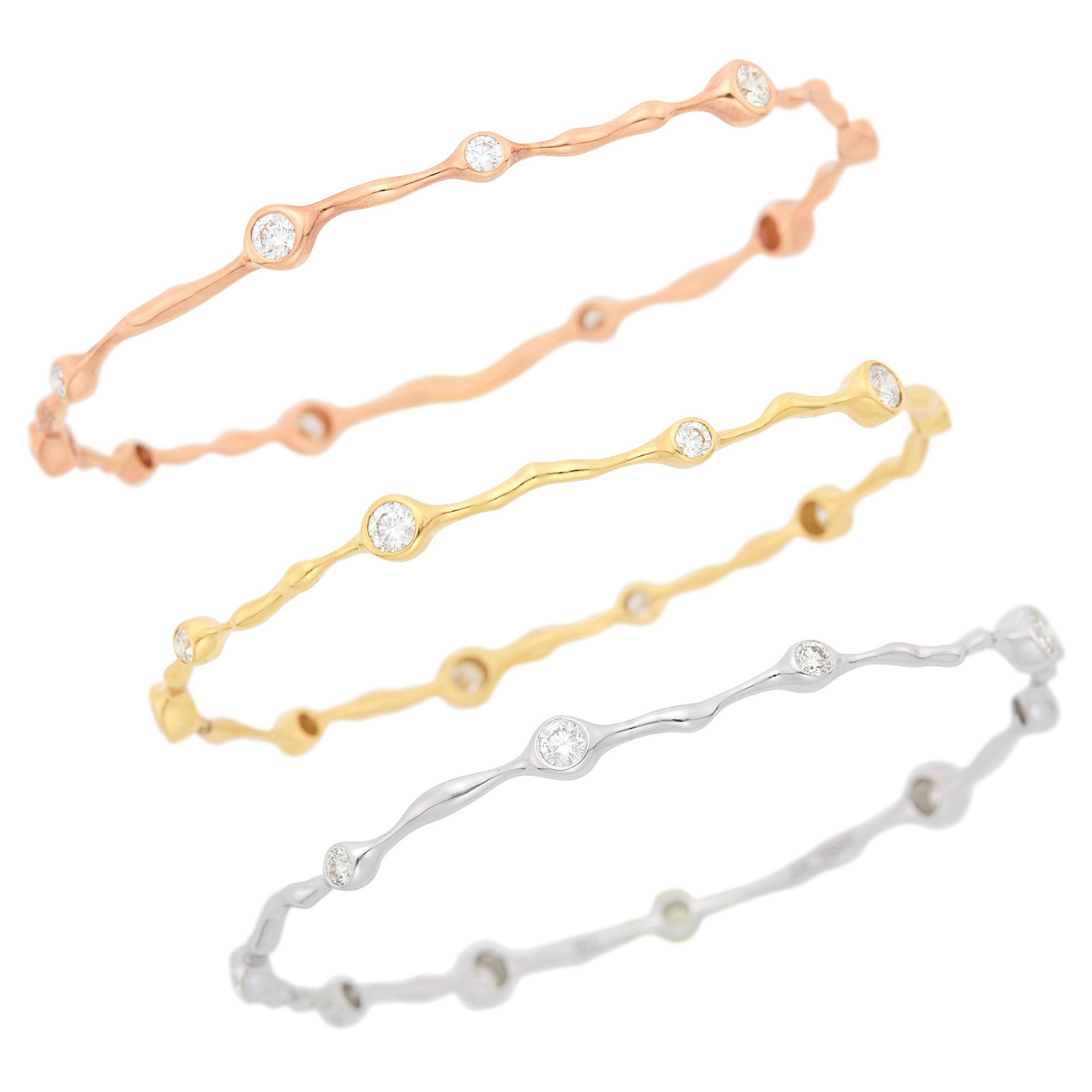 Three Yellow, White and Rose Gold and Diamond Bangle Bracelets: 18 kt. yellow, white and rose gold, 30 collet-set round diamonds ap. 4.45 cts., ap. 19.2 dwts. Inner cir. 7 3/4 and 7 1/4 inches. Diamonds: H-I-J-VS. Collet-set widths 3/16 to 1/8 inch. Bangle widths 
