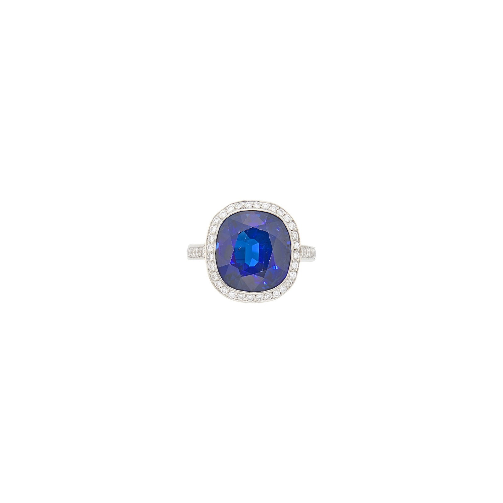 Platinum, Sapphire and Diamond Ring: One cushion-shaped sapphire ap. 9.40 cts., small round diamonds ap. .90 ct., ap. 6.4 dwts. Size 5, with Superfit hinged shank and push-tool to release. With AGL report no. 1156549 stating Thailand ori