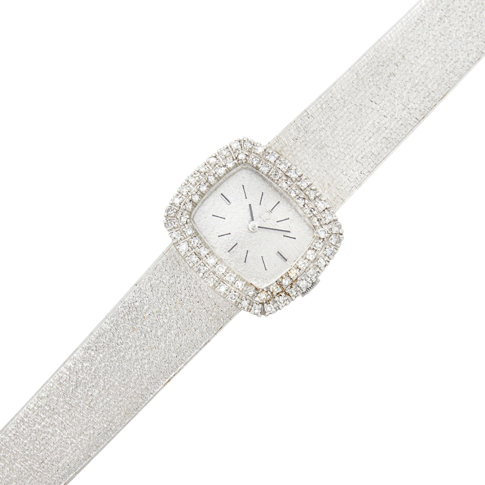Omega White Gold and Diamond ‘Deville’ Wristwatch: 18 kt., mechanical, rectangular bark-textured silver-tone dial applied with chrome and black stick hour markers, single-cut diamonds ap. 1.00 ct., case dia. ap. 23 x 26 mm., bark-textured articulated 