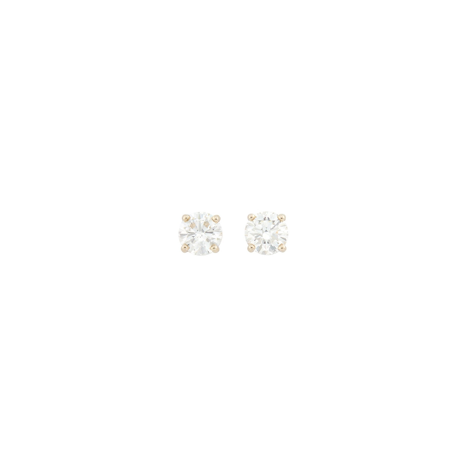 Pair of Low Karat White Gold and Diamond Stud Earrings: 2 round diamonds ap. 2.50 cts. Diamonds: J-K-VS and SI2. Posts.