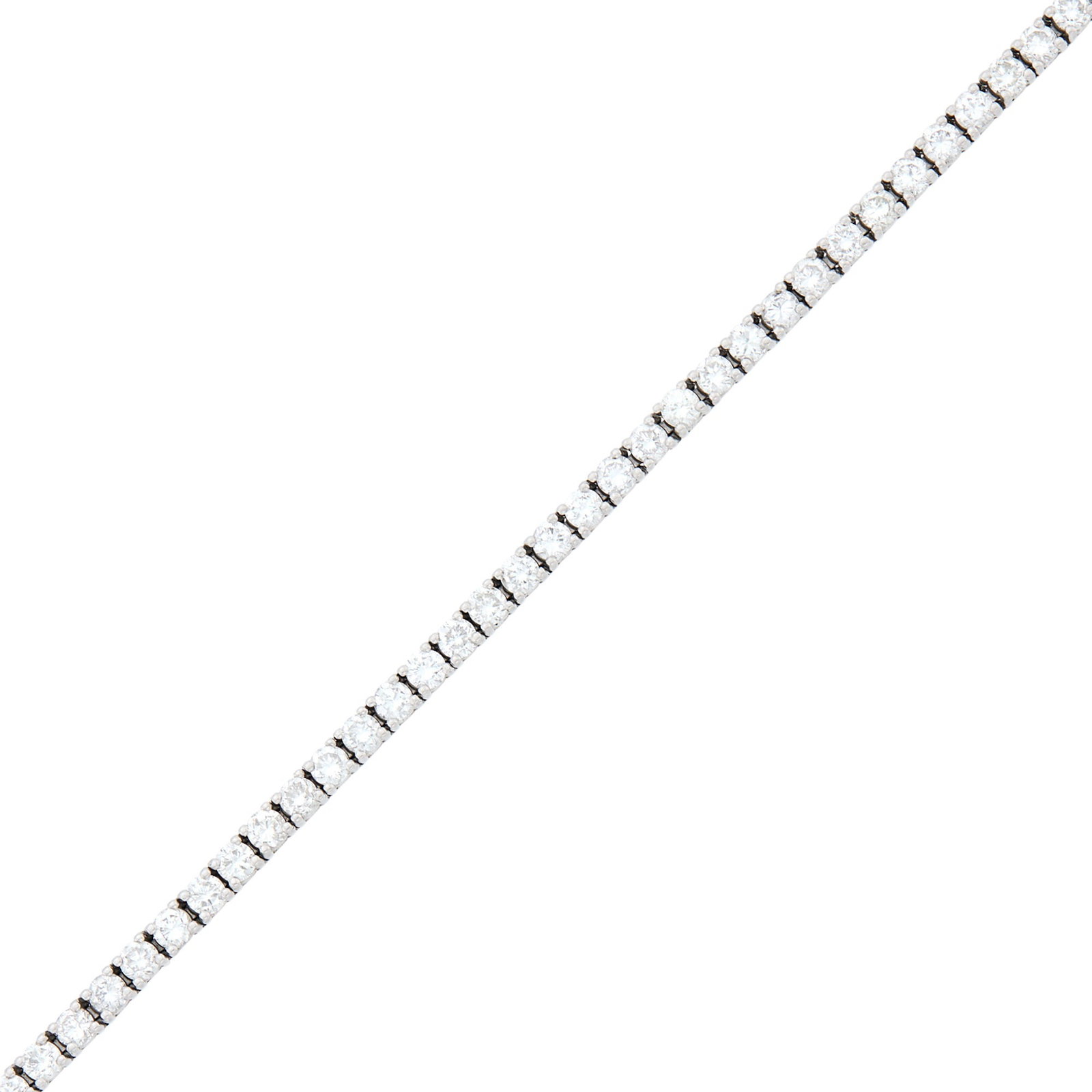 Platinum and Diamond Bracelet: 44 round diamonds ap. 5.70 cts., ap. 13 dwts. Inner cir. 6 1/4 inches. Diamonds: H-I-VS, several SI-I1. Width just under 1/8 inch.