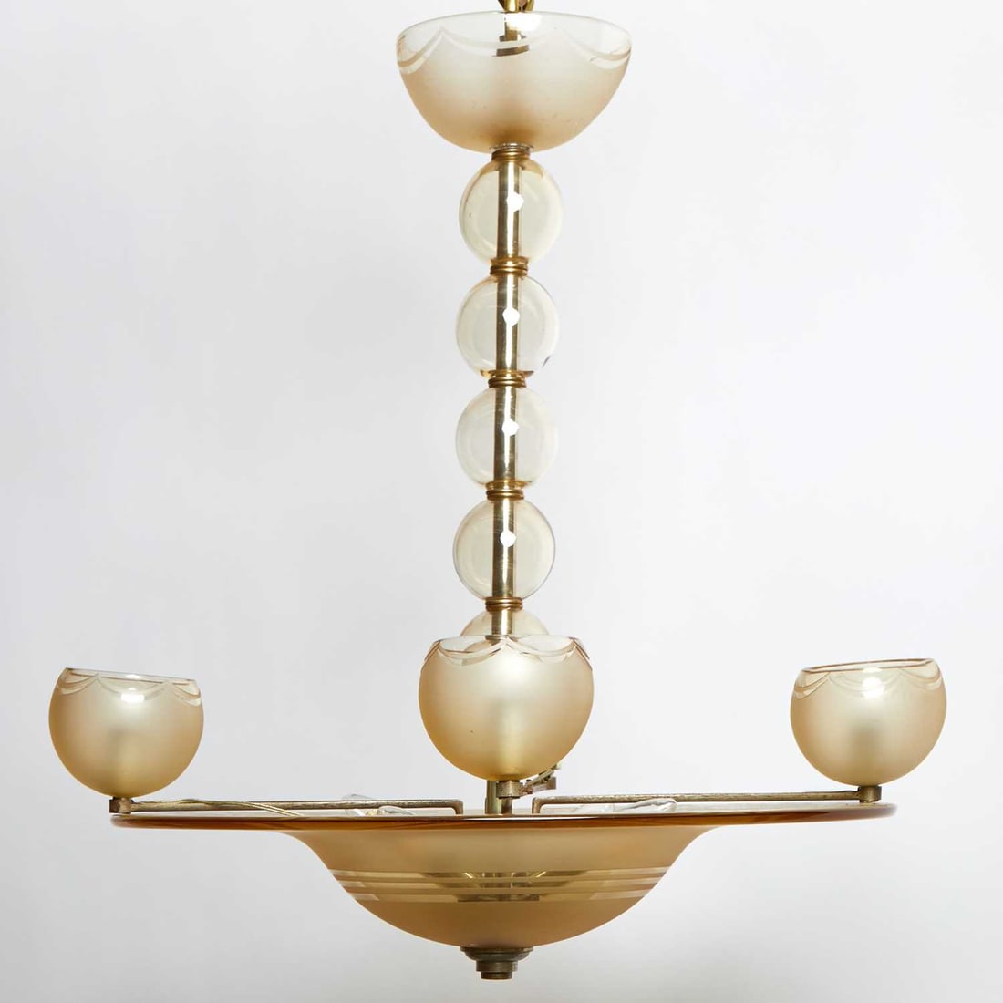 Daum Nancy Amber Glass Four-Light Chandelier: Mid 20th century, with etched signature Height 23 inches, diameter 26 inches one shade missing