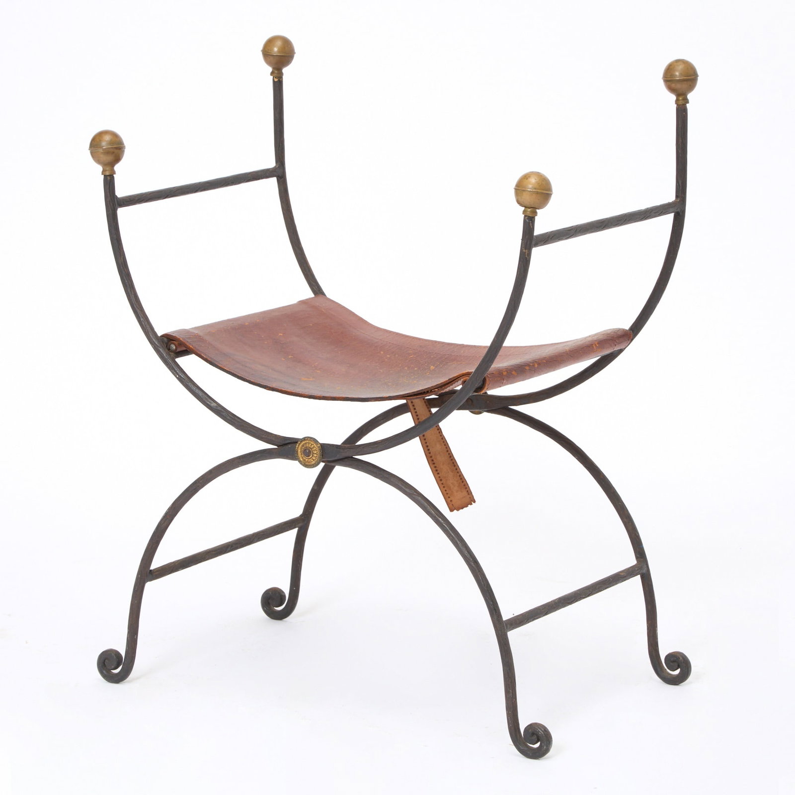 Iron and Brass Campaign Folding Curule Stool: Early 20th century Height 31 inches, width 25 inches, depth 17 inches damaged leather, broken support strap