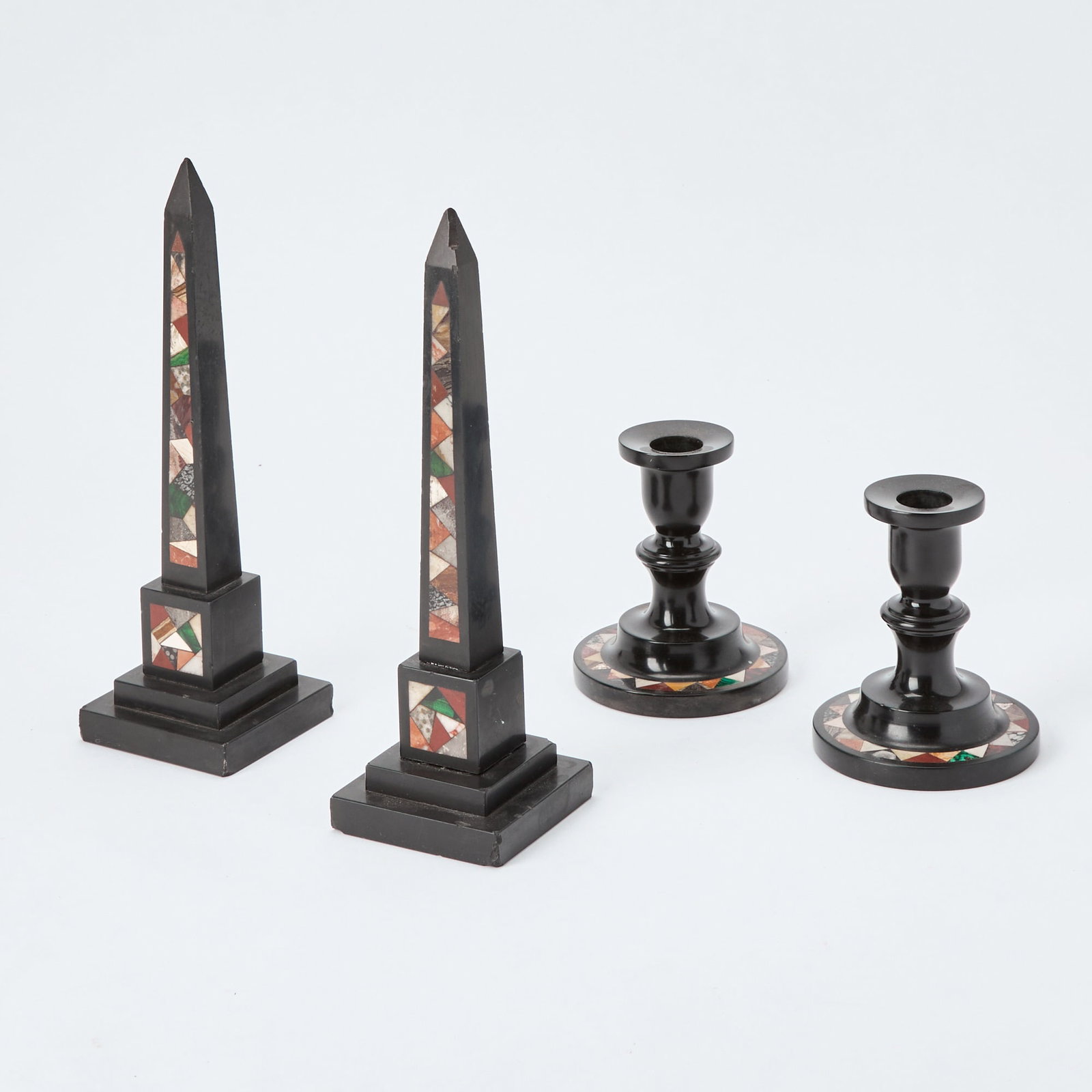 Pair of English Specimen Marble Obelisks: Together with a pair of specimen marble candle holders, second half 19th century Height 10 inches, 4 1/2 inches. Some damage at the base of the obelisks.