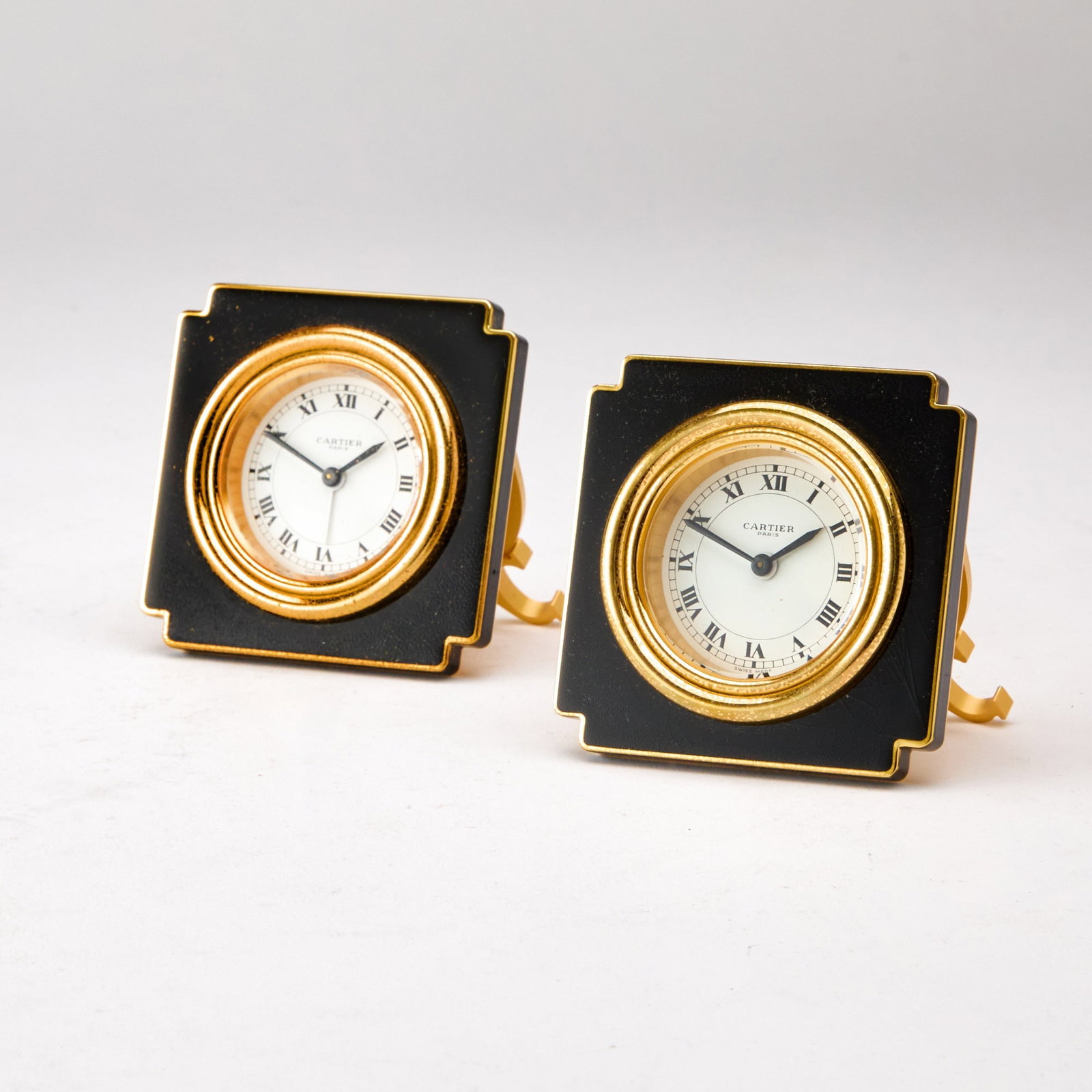 Two Cartier Gilt-Metal and Black Enamel Travel Clocks (1 of 2)