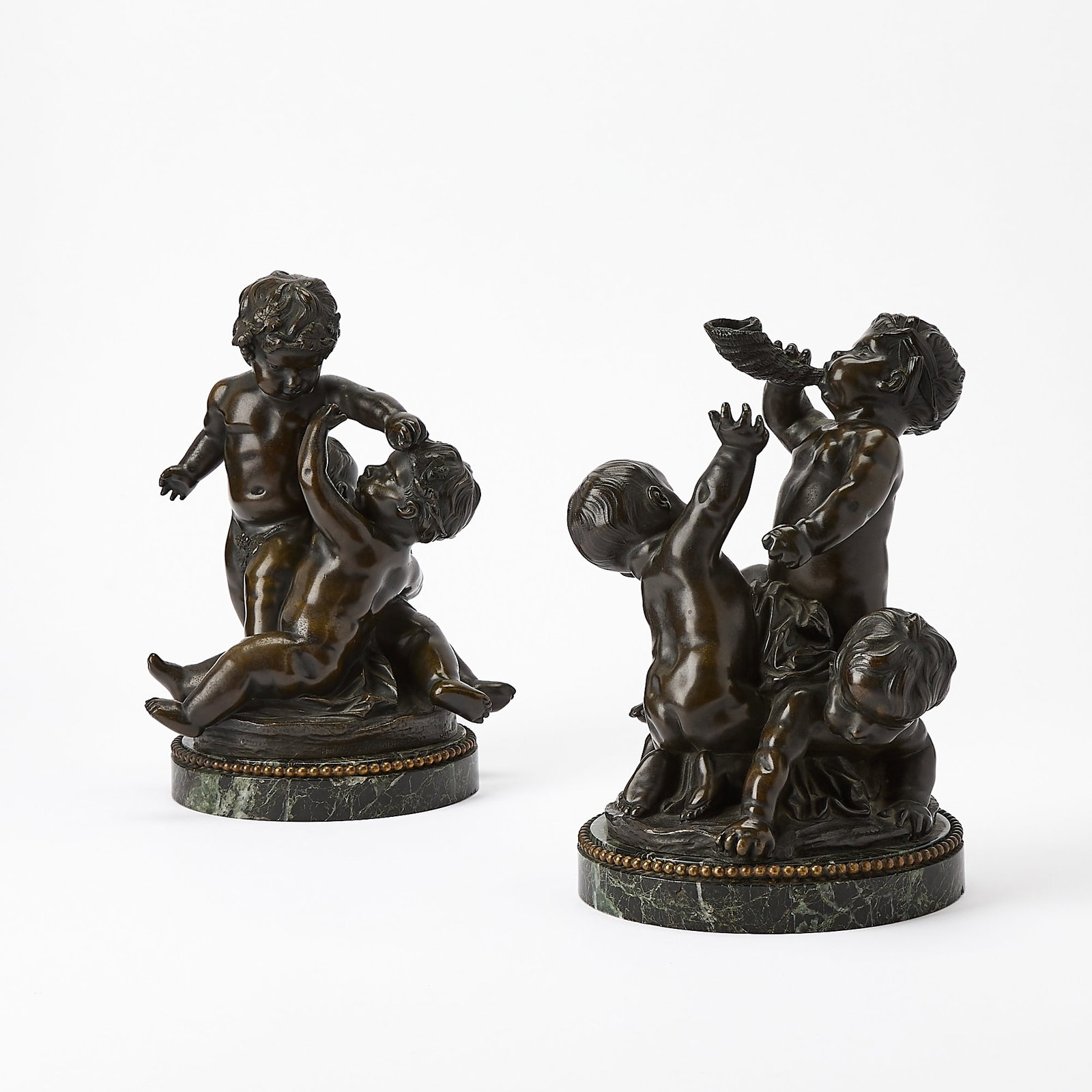 Pair of French Patinated Bronze Figural Groups: After Clodion, cast by H. Rouard foundry, France, circa 1924-35 Height 10 3/4 inches, diameter 8 inches