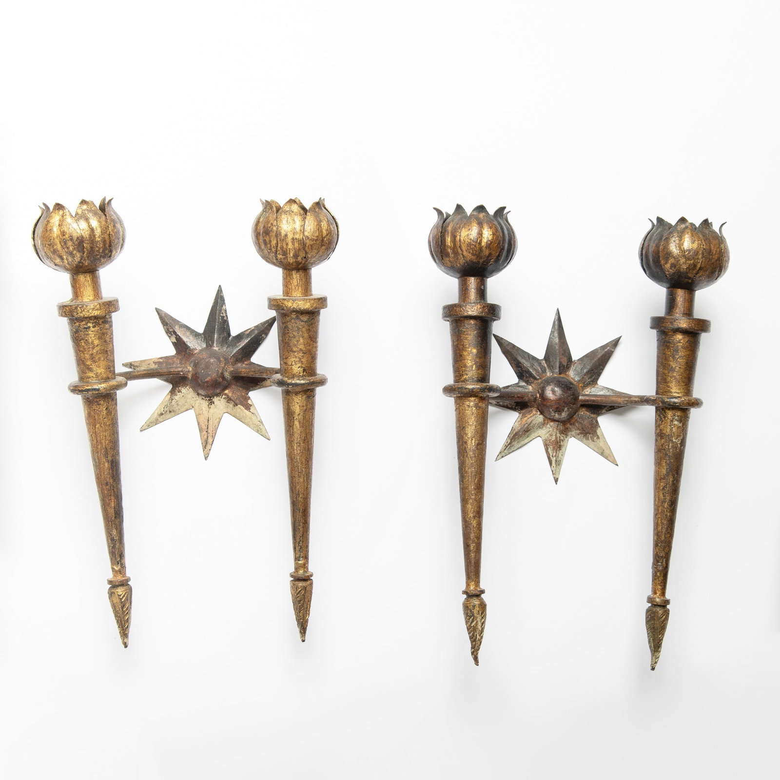 Pair of French Art Deco Gilt-Metal Wall Lights: In the manner of Gilbert Poillerat, mid-20th century Height 13 1/2 inches, width 9 inches, depth 5 inches Some dings and dents, rubbing and losses to finish.