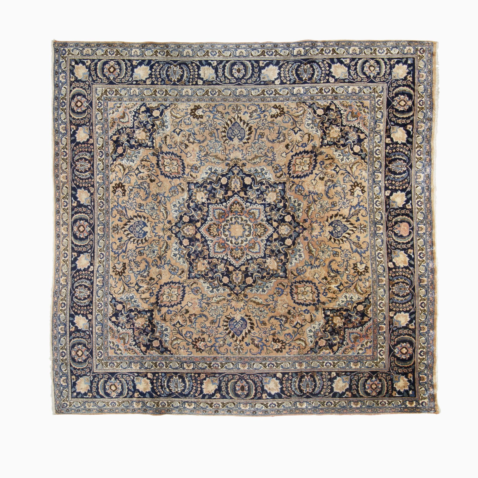 Mashad Carpet: East Iran, Mid-20th Century The central circular pendant medallion flanked by complementary spandrels on the terracotta field is within a midnight blue meandering vine border. Signed. (9' 11" x 9'