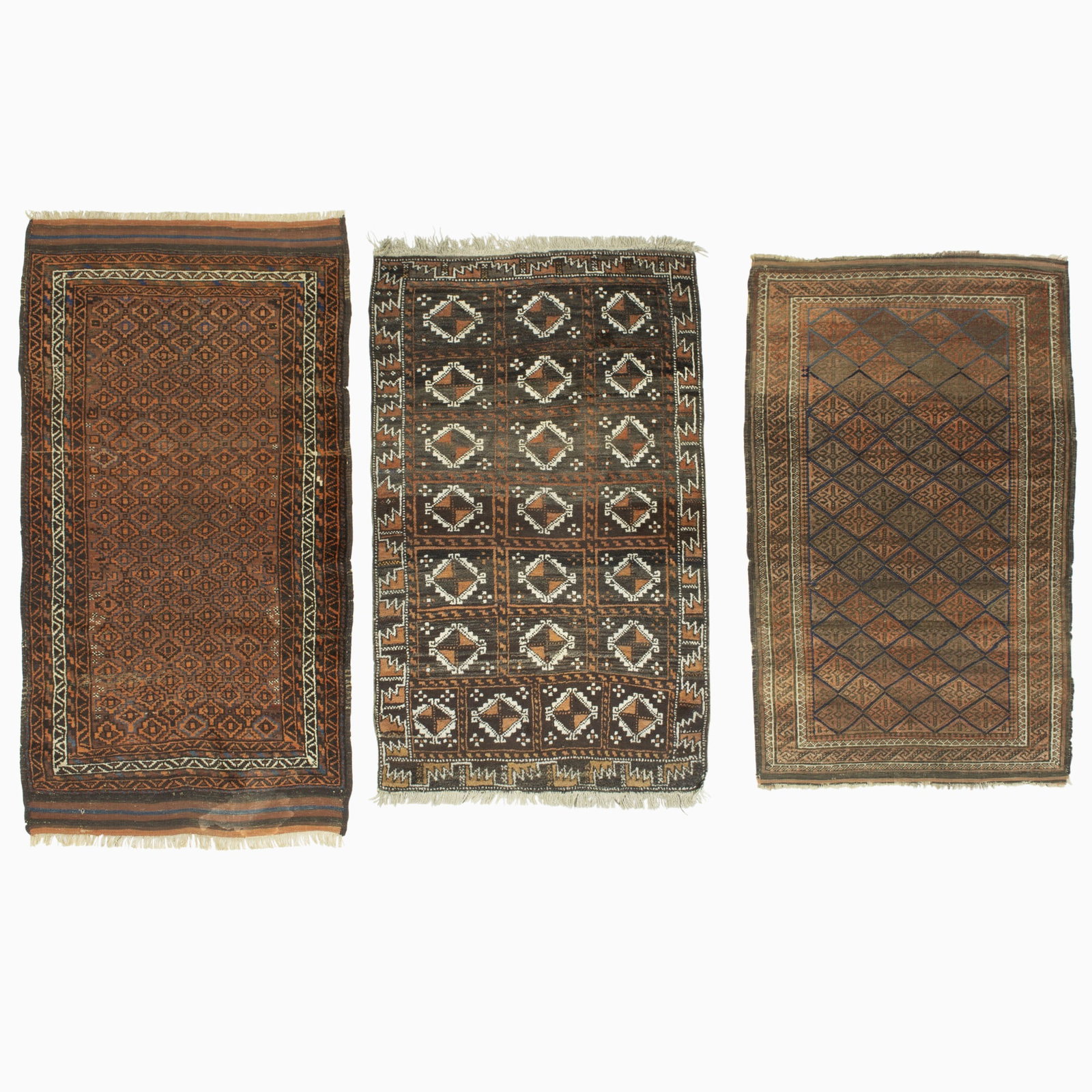 Three Baluch Rugs: East Persia, 20th Century (5' 9" x 3' 1", 5' 0" x 3' 2", and 4' 9" x 3' 0" respectively) 5' 9" x 3' 1" - areas of wear, stain 5' 0" x 3' 2" - good condition 4' 9" x 3' 0" - even overall wear
