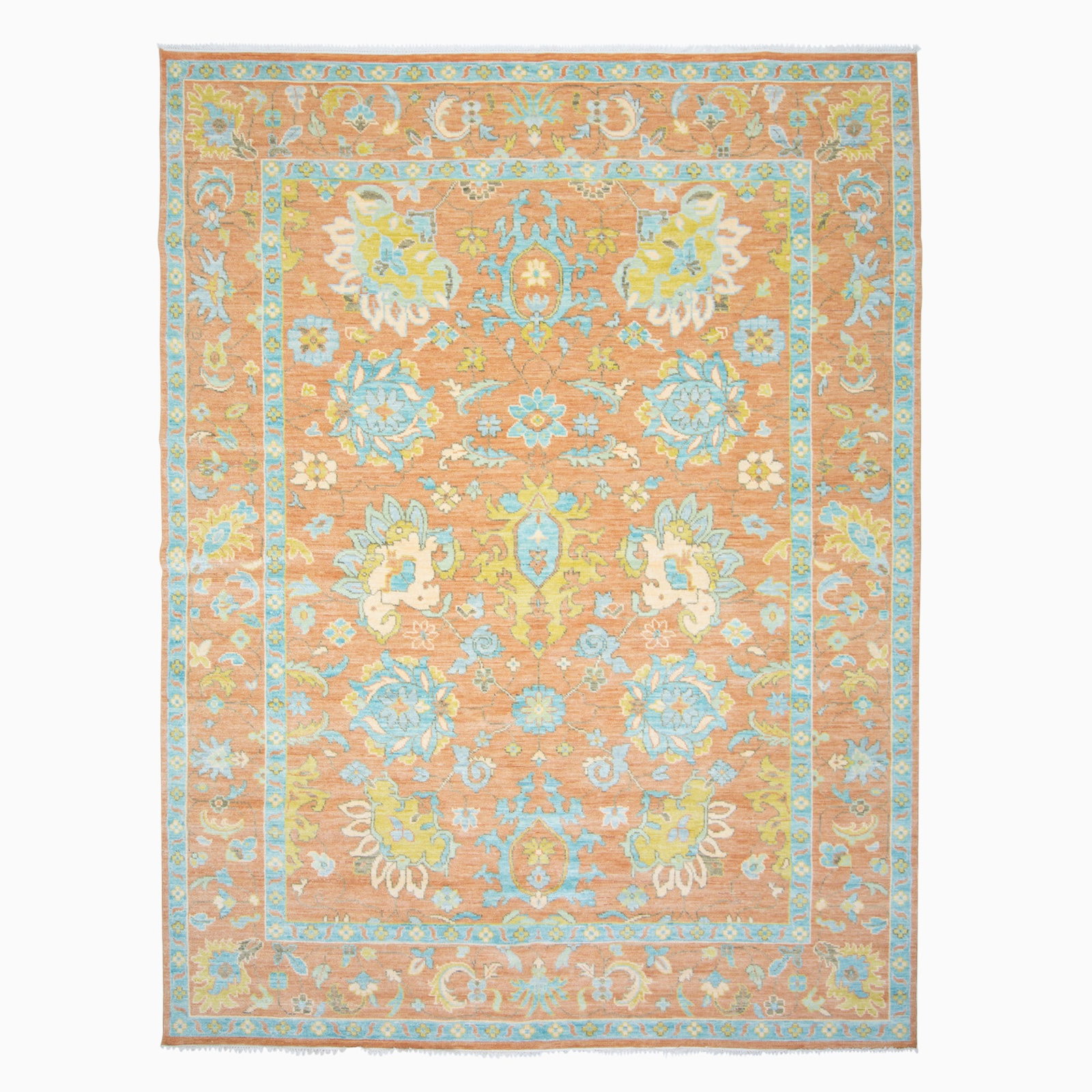 Indo-Oushak Carpet: India, Contemporary The allover pattern of large-scale floral vinery on the rust field is within a palmette and vine border. (11' 6" x 8' 11")