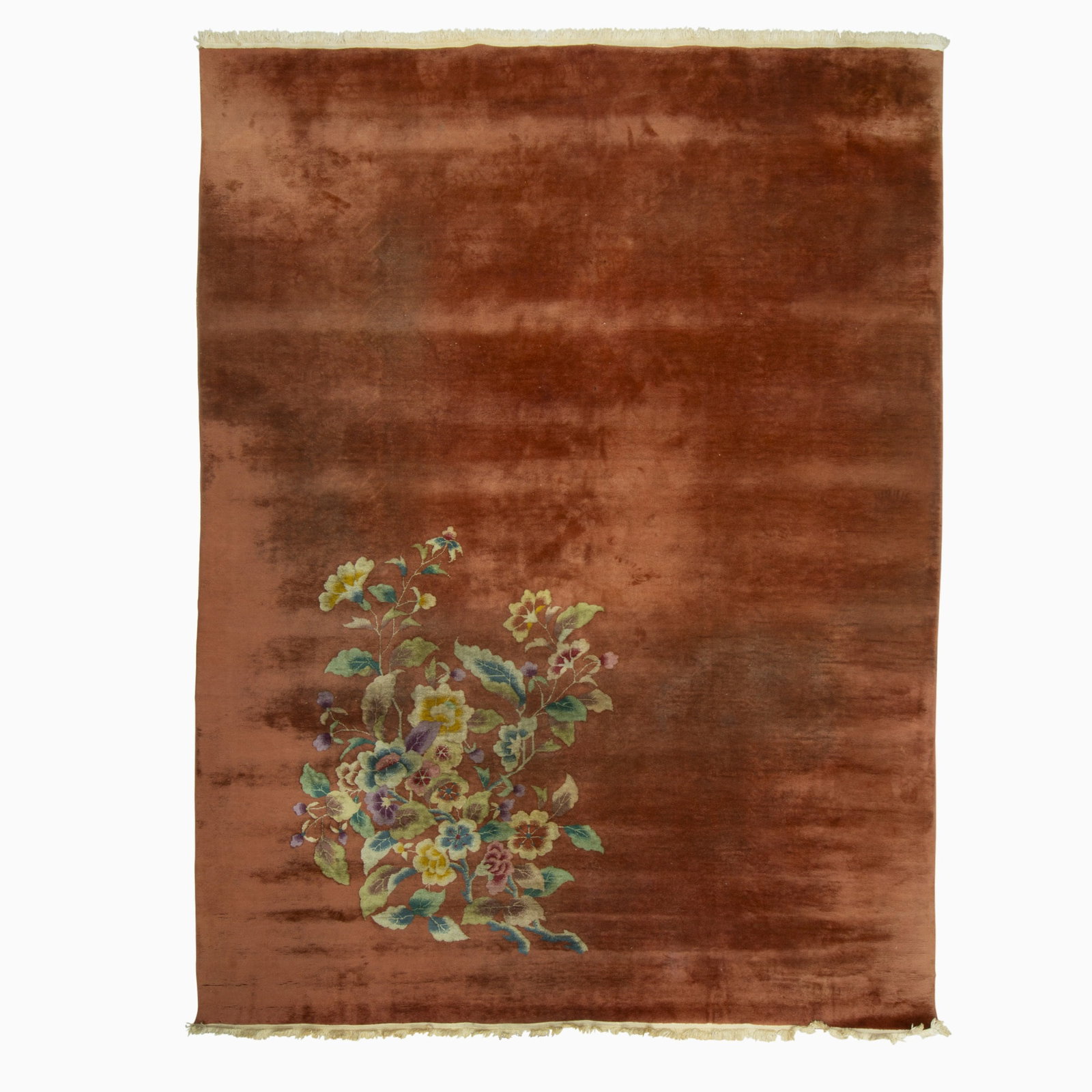 Nichols Art Deco Chinese Carpet: China, Circa 1925 Having a polychrome floral spray on an open copper field. (11' 4" x 8' 10") Soiled areas, small spot stains, added machine fringes