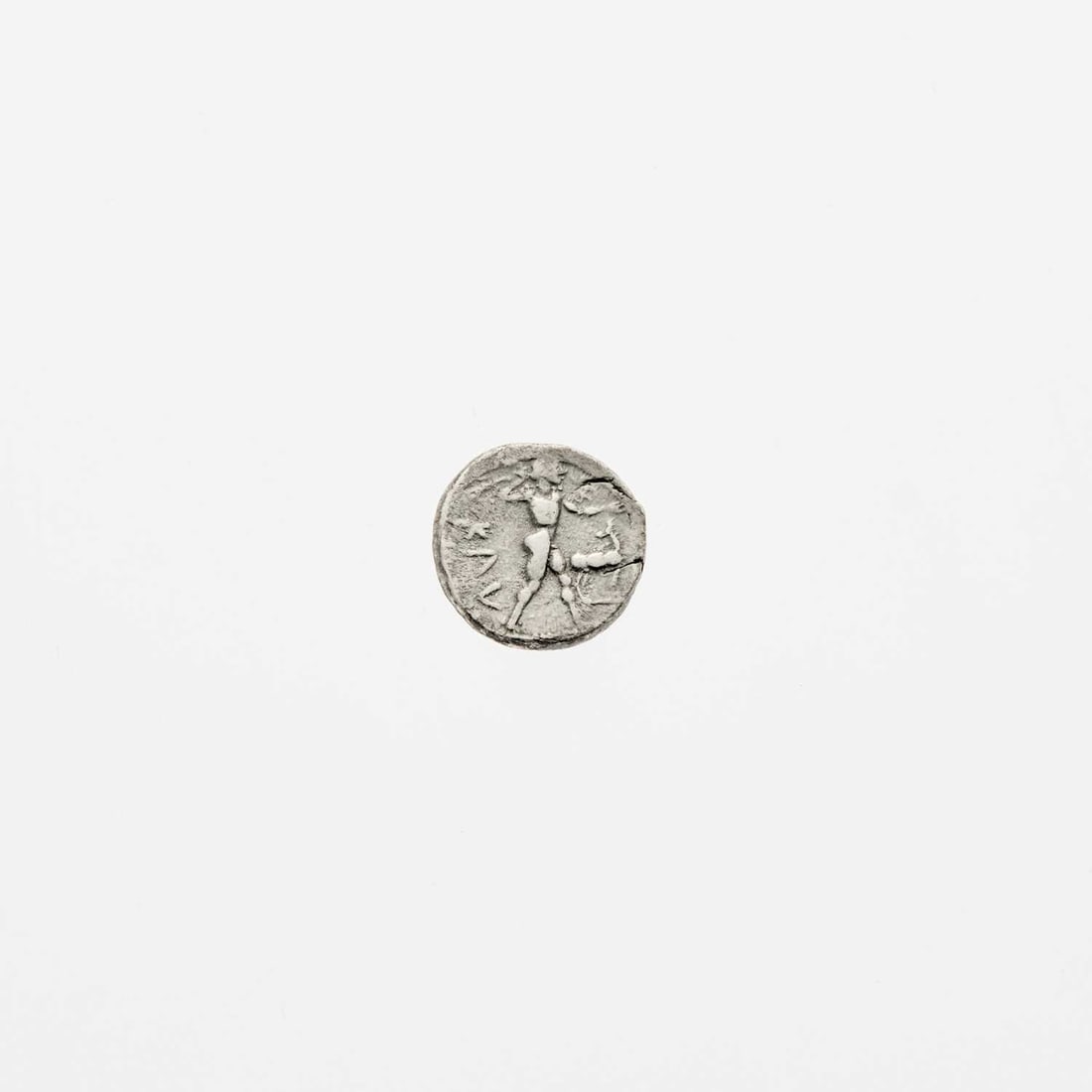 Bruttium, Kaulonia. c. 475-425 B.C.E. AR Nomos. 7.92g. 20mm.: OBV: Apollo advancing right, branch in extended hand. Daimon at left, running rightwards, stag standing at right, head facing left. REV: Stag standing right. Fine. Noe 69; SNG ANS 169; HN Italy 2044.
