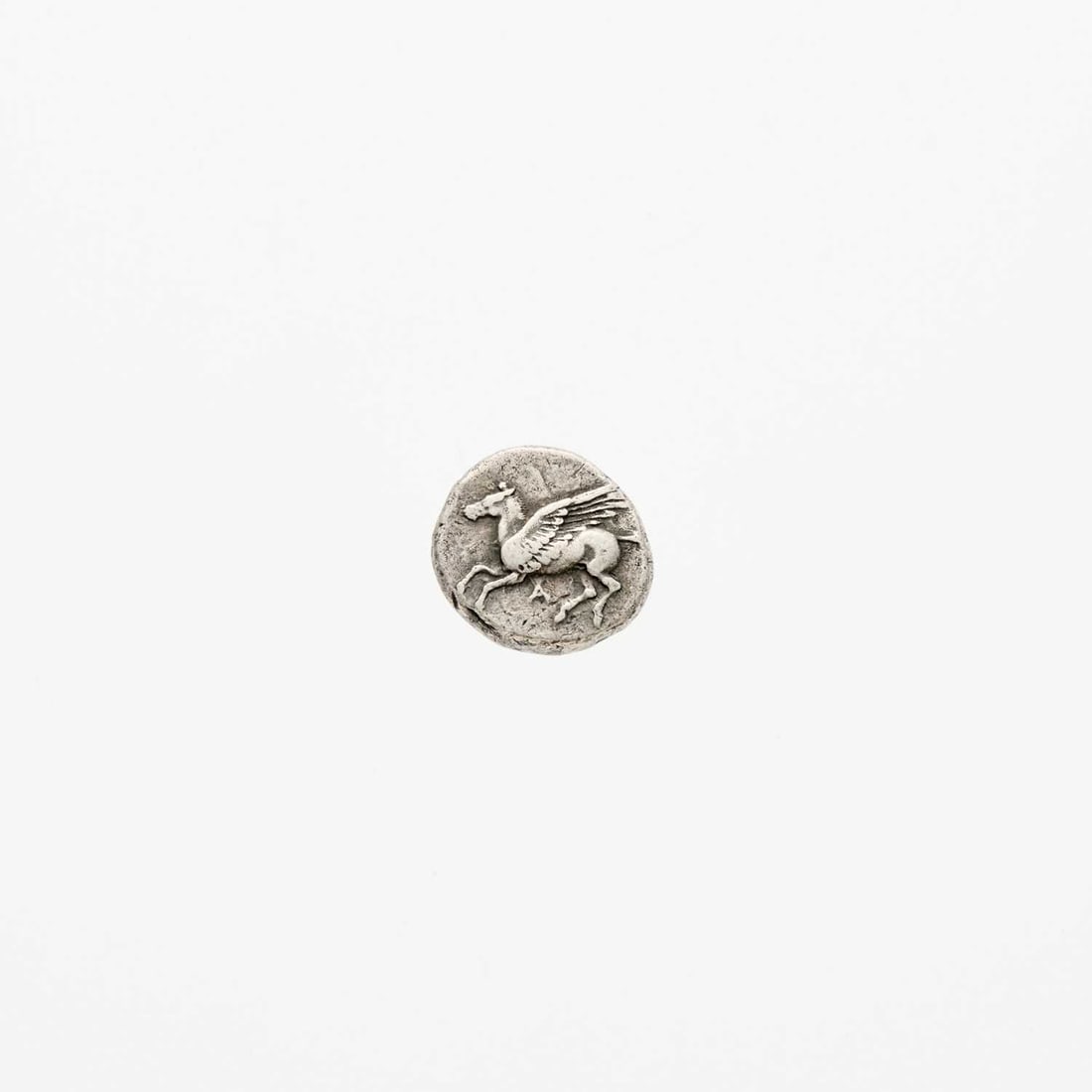 Epirus, Ambracia. c. 456-426 B.C.E. AR Stater. 8.52g. 20mm.: OBV: Pegasus flying left, "A" below REV: Corinthian helmeted head of Athena, left, caduceus behind. "A" above and right. Calciati, Pegasus 17. Nice Very Fine, pretty old cabinet toning.