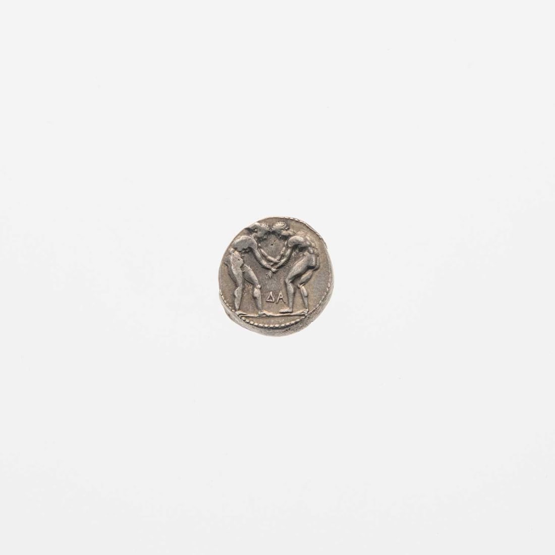Pamphylie, Aspendos. c. 420-370 B.C.E. AR Stater. 11.06g.: OBV: Two wrestlers face off. REV: Figure extending sling rightward, triskelion at right, within square beaded border. Nice Very Fine, nick on reverse. SNG Paris 87; SNG von Aulock 4550 var.