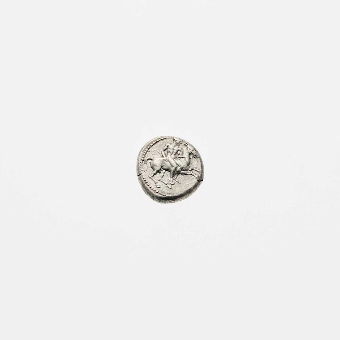 Cilicia, Kelenderis. c. 410-375 B.C.E. AR Stater. 10.53g. 20mm.: OBV: Nude ephebe on horseback riding right, holding reins in left hand and goad in right. REV: Goat kneeling right, head facing left. Nice Fine. Casabonne Type 4; SNG Levante; SNG PAris 69.