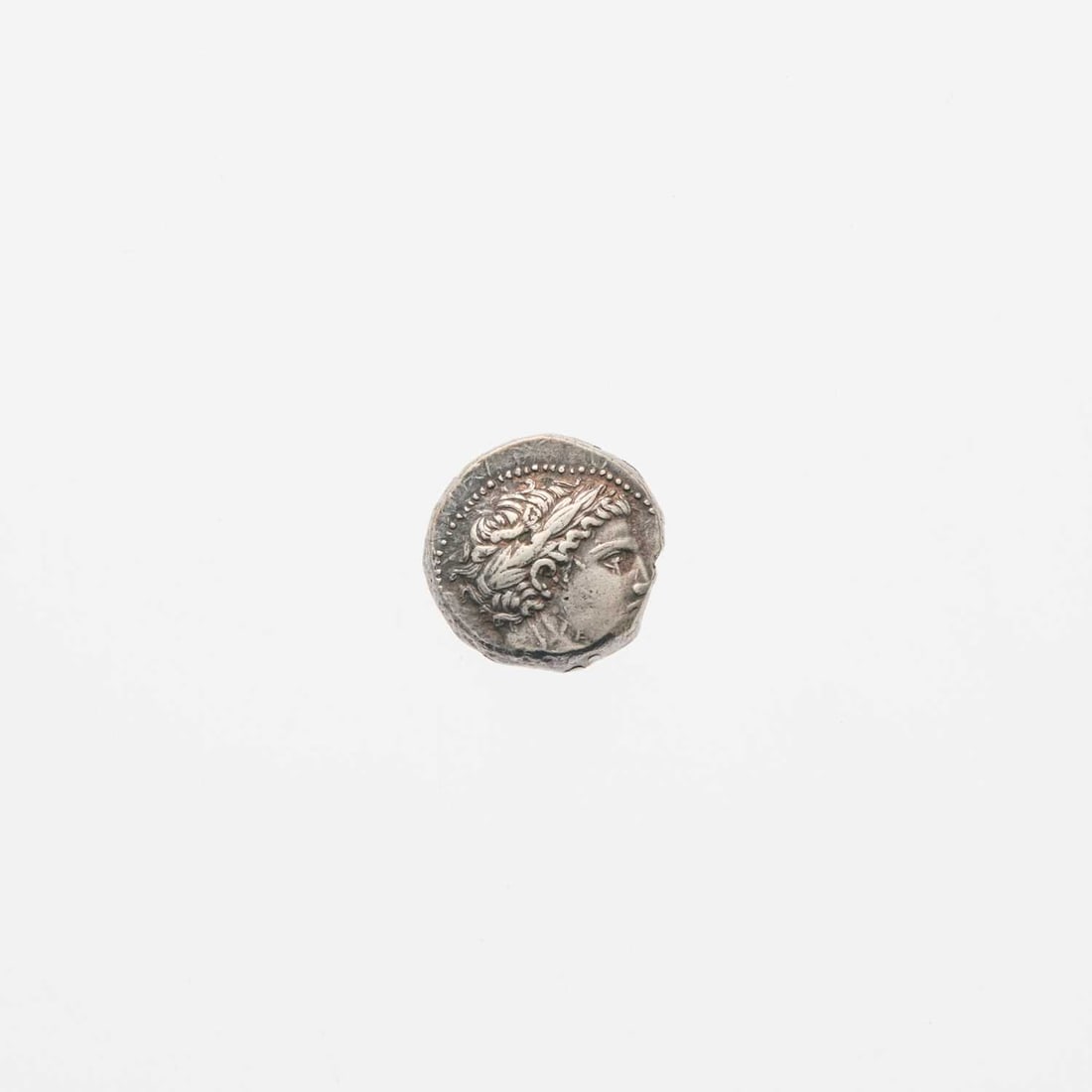 Patraus. c. 335-315 B.C.E. AR Tetradrachm. 11.87g.: OBV: Laureate head of Apollo, right. REV: Warrior on horseback attacking right, spearing a fallen combatant. Off-center strike, even, attractive old cabinet tone. Very Fine. AMNG III, 4; Paeonian Hoar