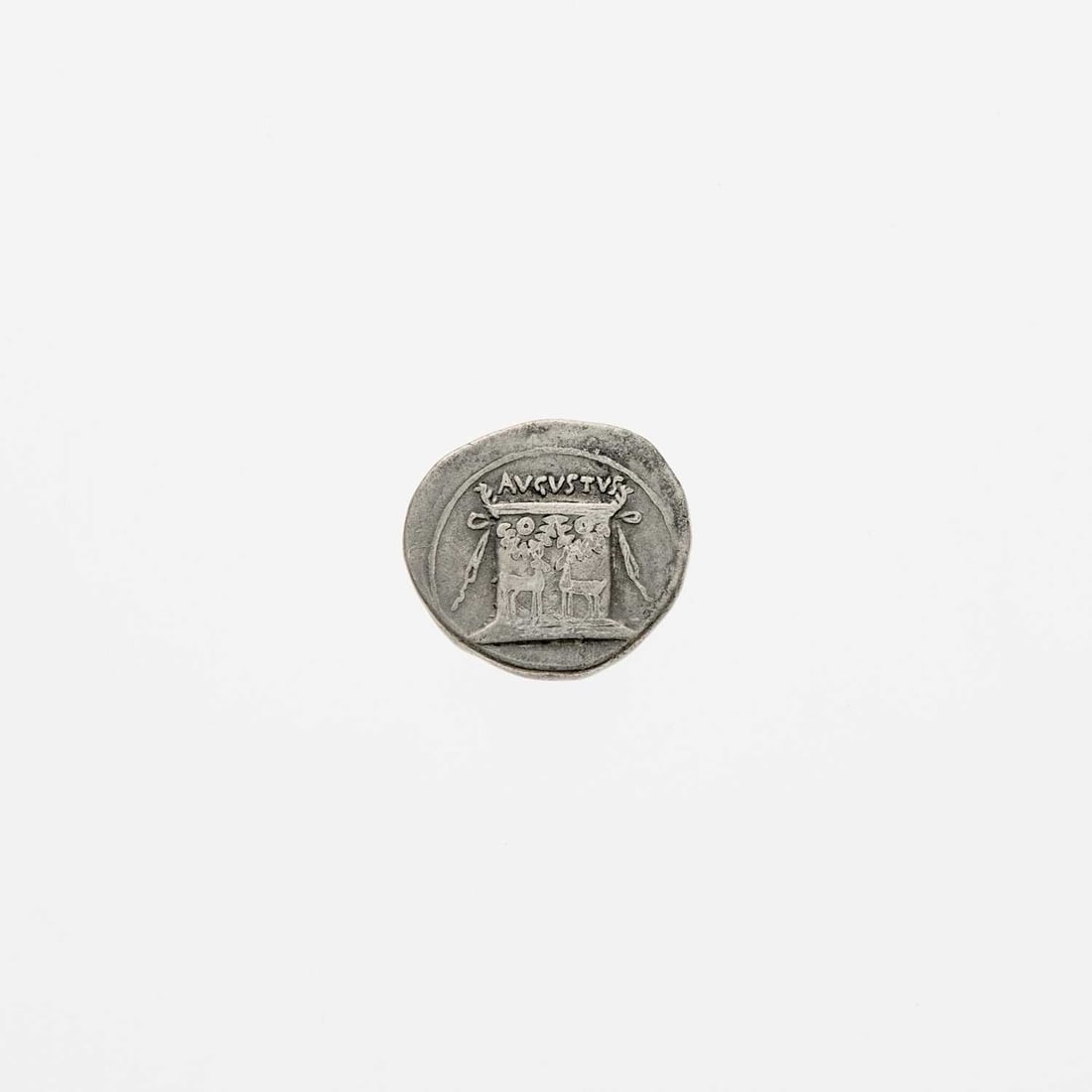 Augustus, c. 27-14 B.C.E. AE Cistophor. 11.39g.: OBV: Bare head of Augustus, right. REV: Altar with two stags. Very Fine, minor corrosion. RIC 479.