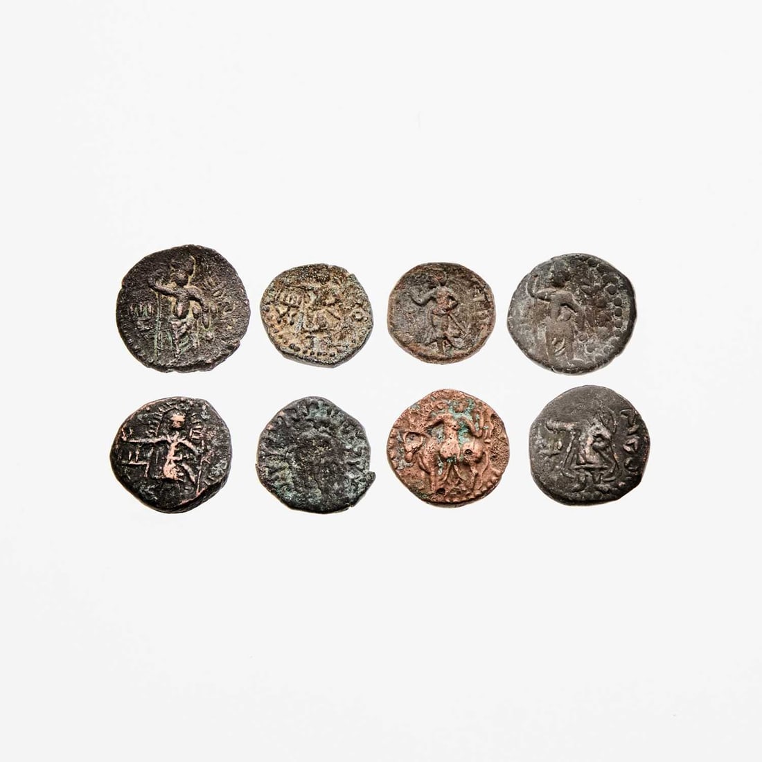 Group of 1st-2nd Century Kushan Bronze Coins.: Eight pieces. Indo-Greek. Condition generally rough, Good to Fine, some with verdigris and corrosion <