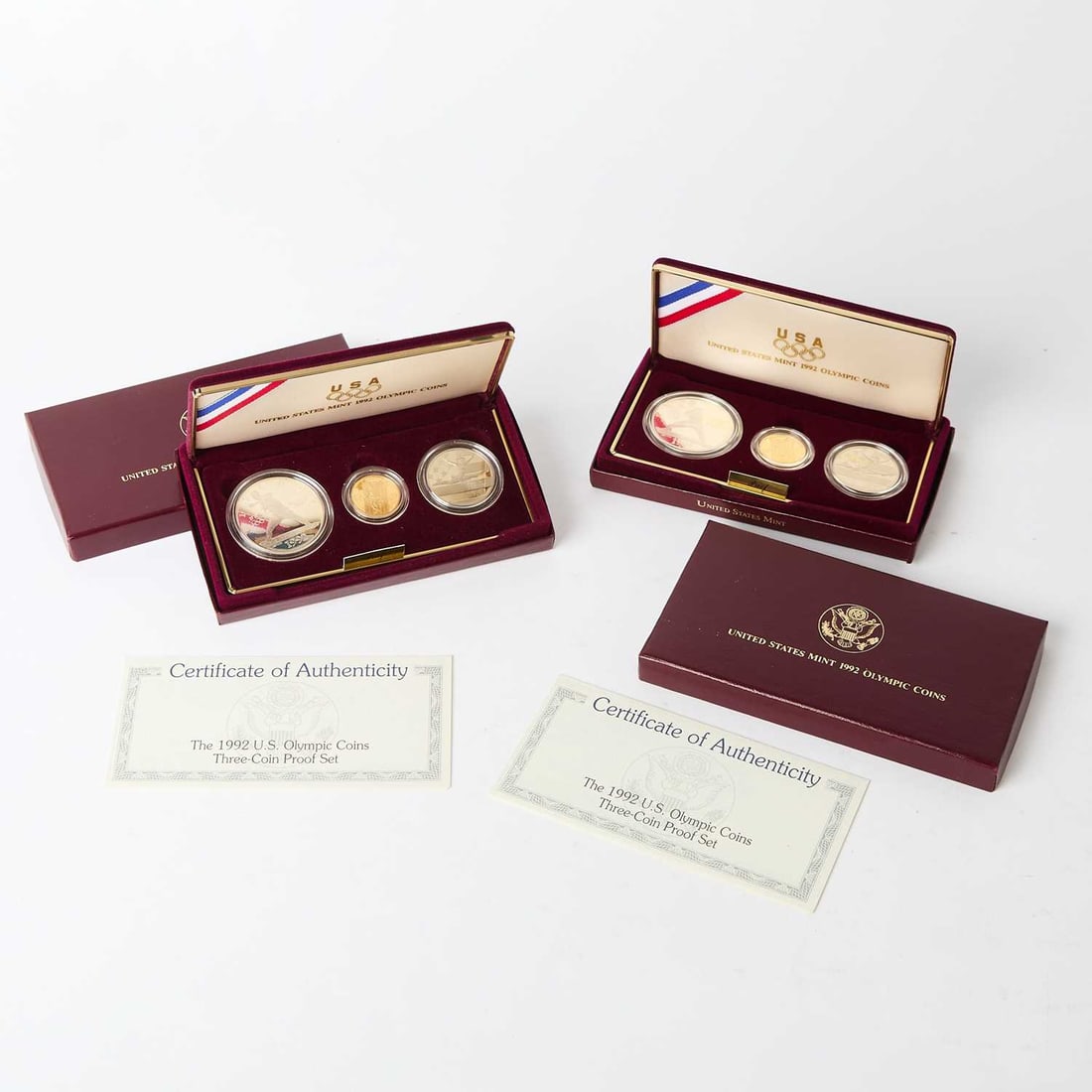 United States. Pair of 1992 Olympic Commemorative Proof Sets. OGP.: Both have full original government packaging. Includes gold $5, silver dollar, and copper-nickel half dollar.