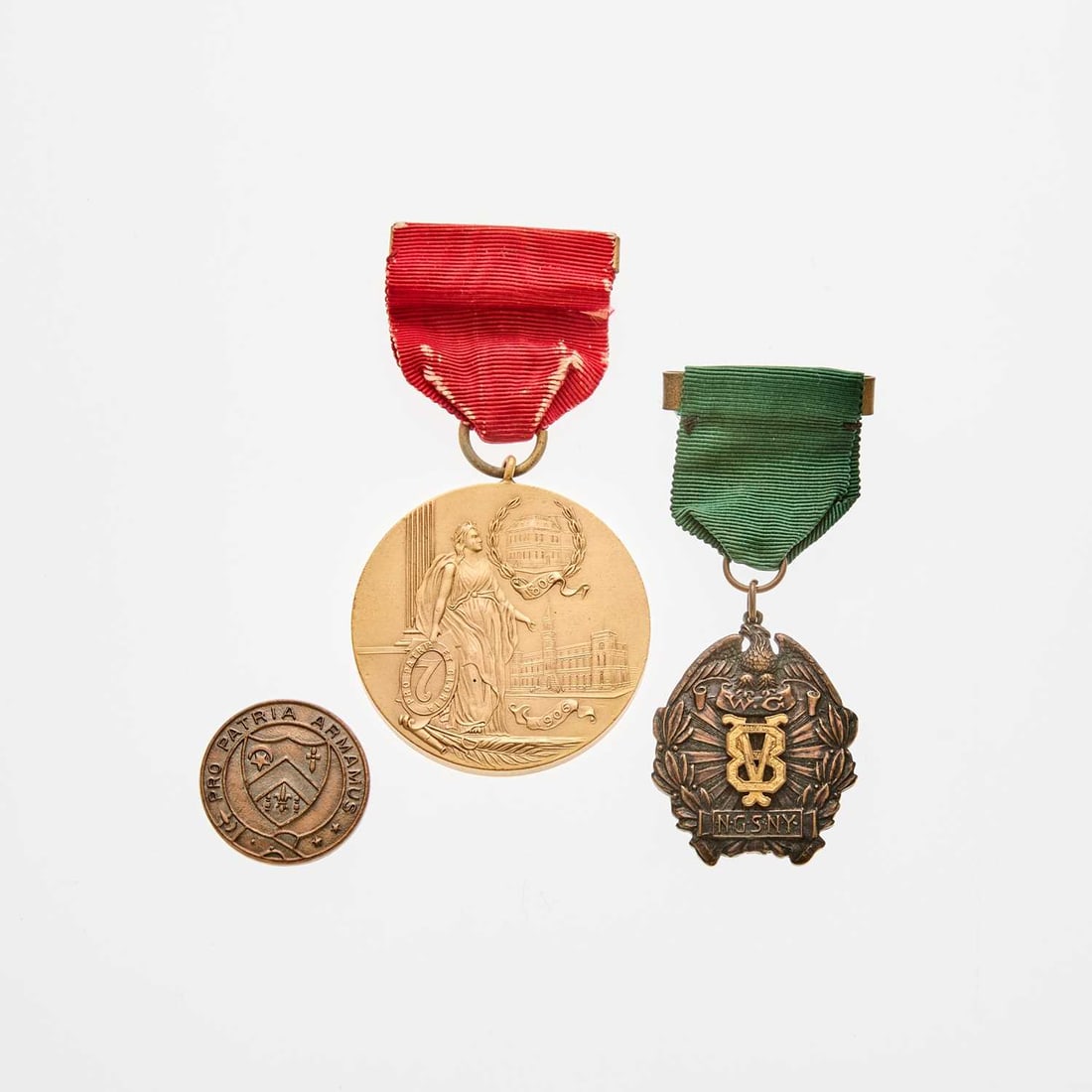 United States, New York. 20th Century Military Medals. Grades Vary.: Seven pieces, honoring military service for New Yorkers. Includes: 1906 Centennial of the Seventh Regiment Medal. Gilt Bronze. Looped for suspension, intact ribbon. By Bailey, Banks, & Biddle. Inc