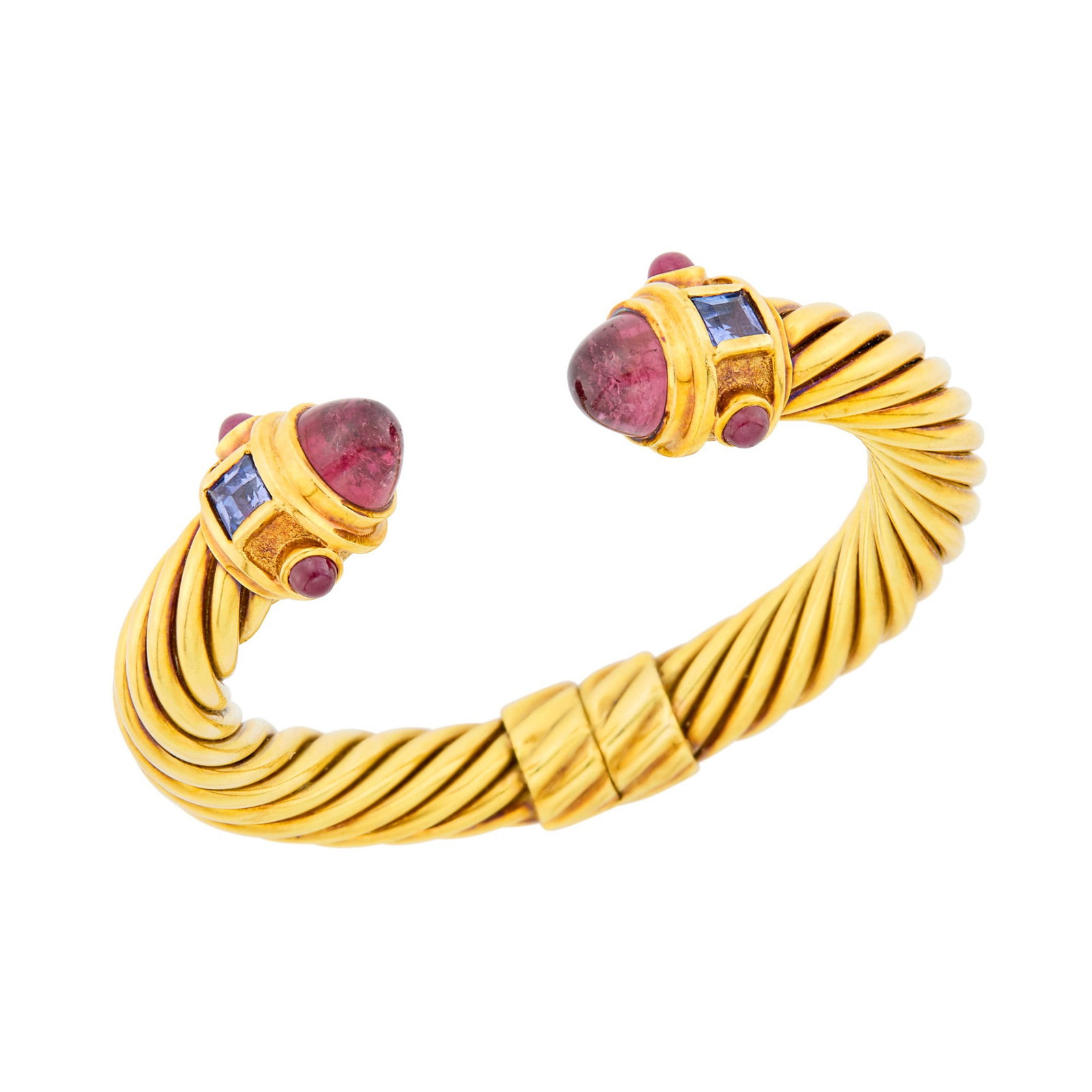 David Yurman Fluted Gold, Cabochon Pink Tourmaline and Gem-Set Bangle Bracelet: 14 kt., 2 round cabochon pink tourmalines ap. 9.8 mm., 2 square-cut iolites, 4 round cabochon rubies, signed D. Yurman, ap. 31 dwts. Inner cir. 6 1/2 inches, with open front.
