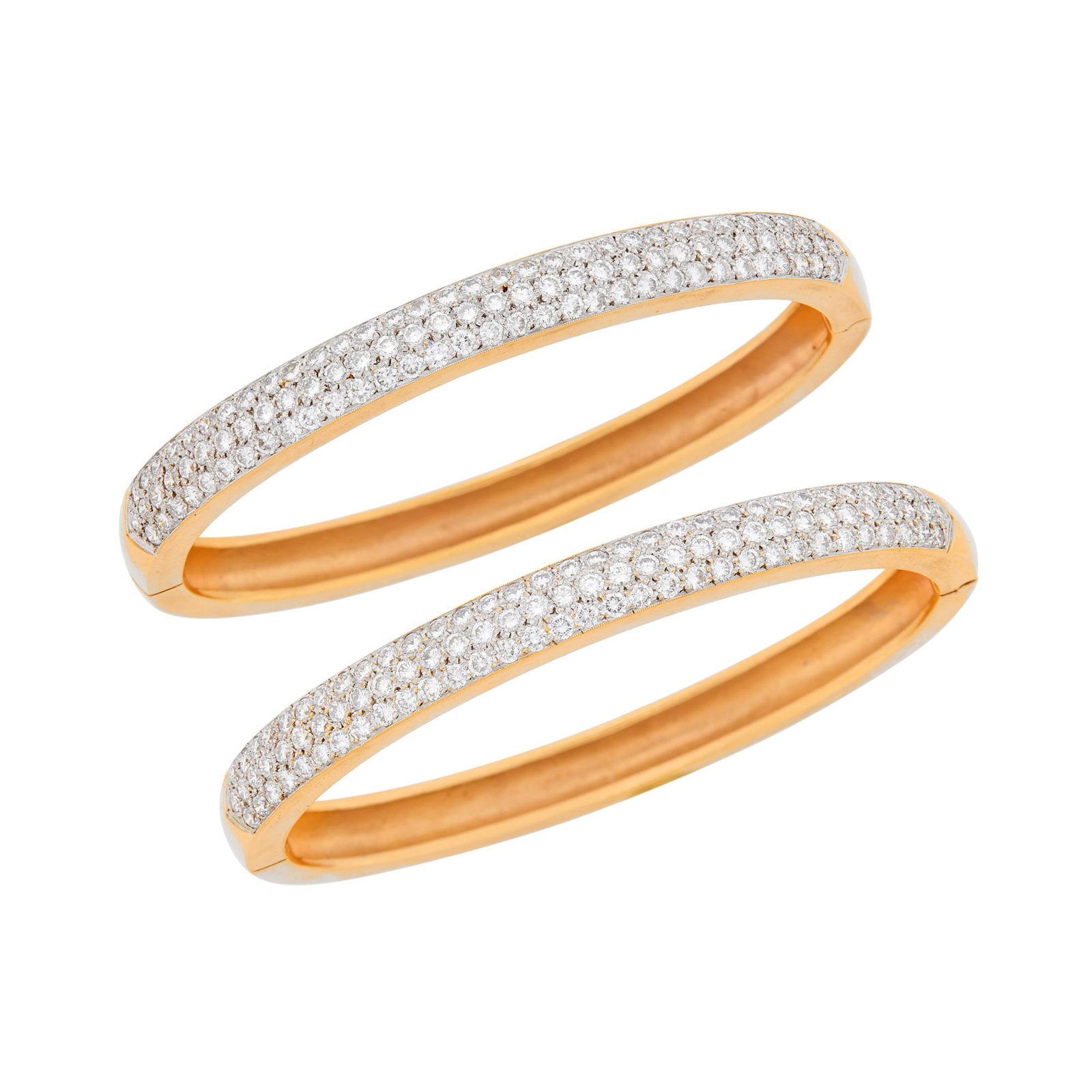 Pair of Two-Color Gold and Diamond Bangle Bracelets: 14 kt. yellow and rose gold, 194 round diamonds ap. 7.75 cts., ap. 56.5 dwts. Inner cir. 7 inches.