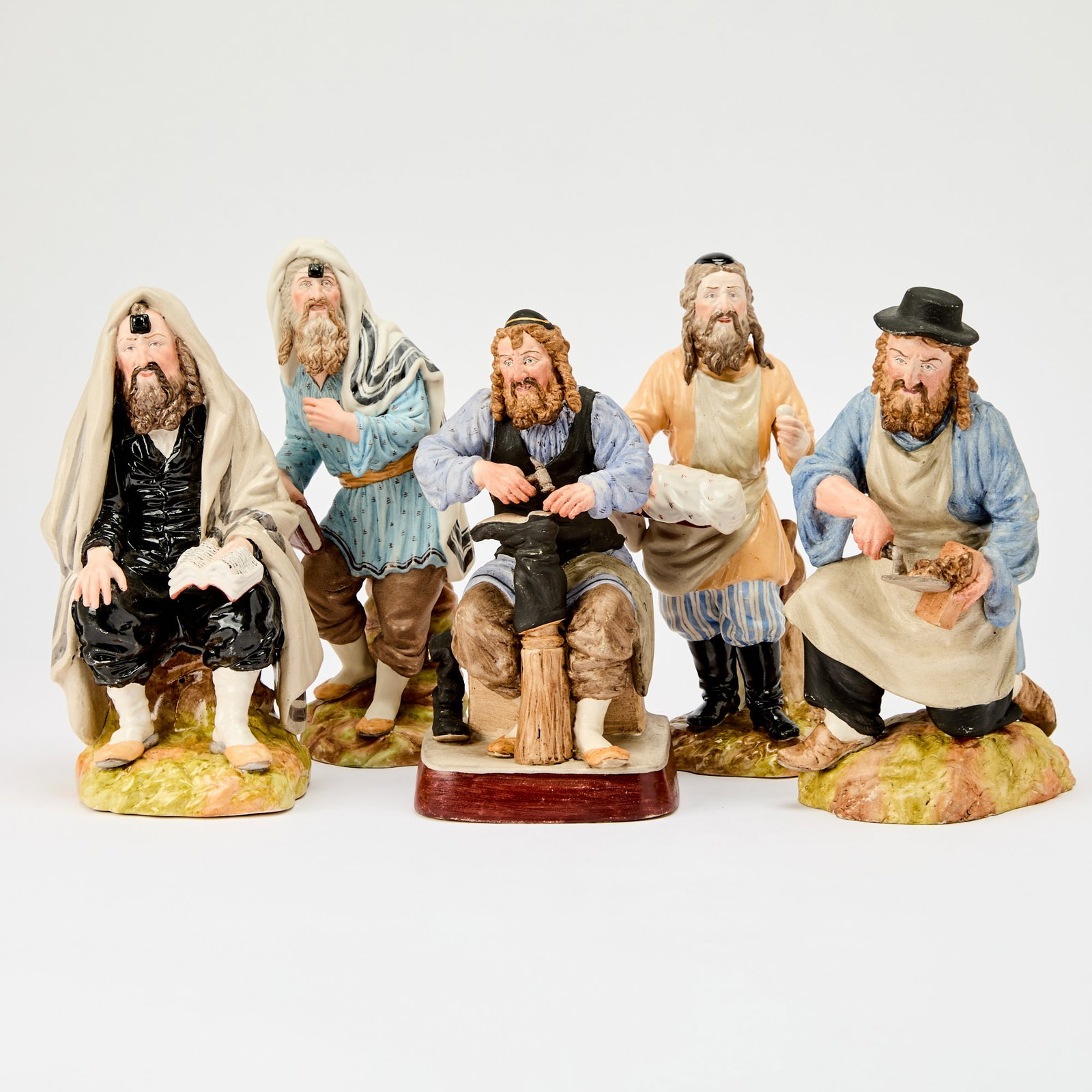 Group of Five Russian Style Porcelain Figures: With spurious marks for Gardner, 20th century. Height of tallest 8 3/4 inches.