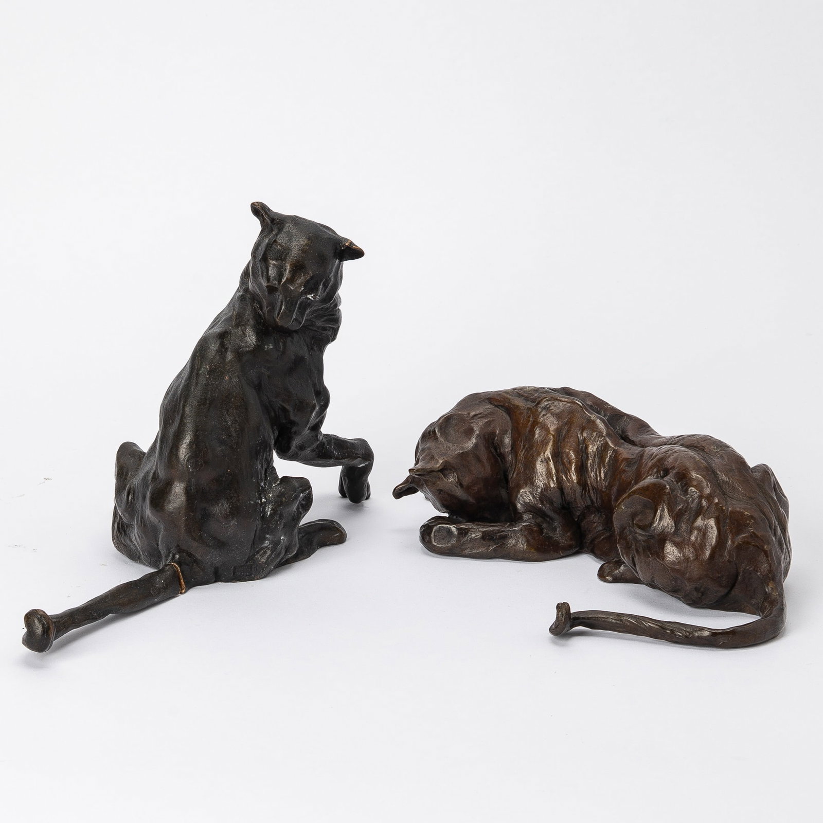 José Maria David: French, b. 1944 (i) Seated Feline, 1996 Signed David, dated 1996, numbered 1/8 and stamped Cire Perout Roy Foundry near the base Bronze with dark-brown patina Height 6 7/8 inches (17.5 cm) (ii)
