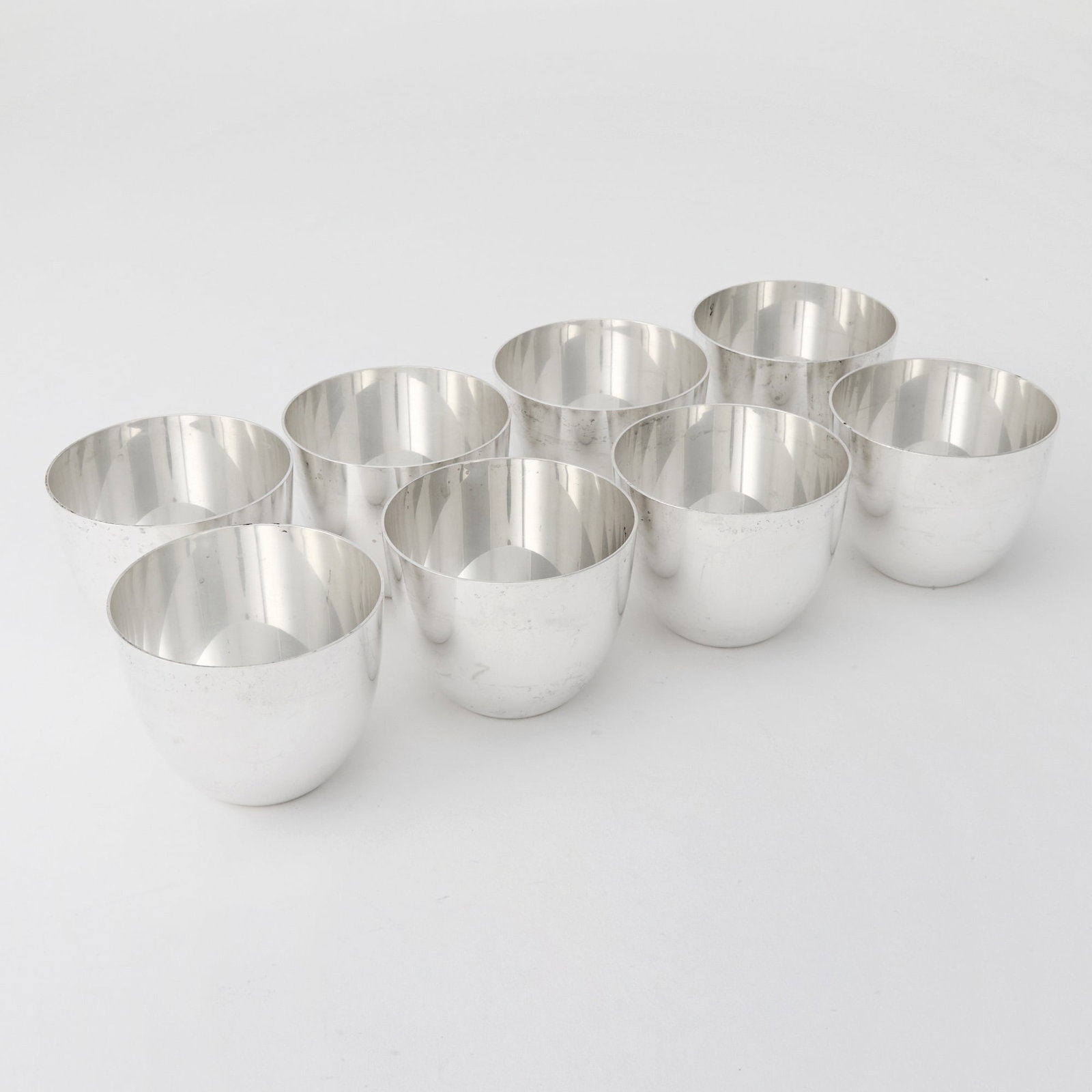 Set of Eight American Sterling Silver "Jefferson" Tumbler Cups: Empire, second half 20th century Diameter 3 1/4 inches, total approximately 41 ounces.