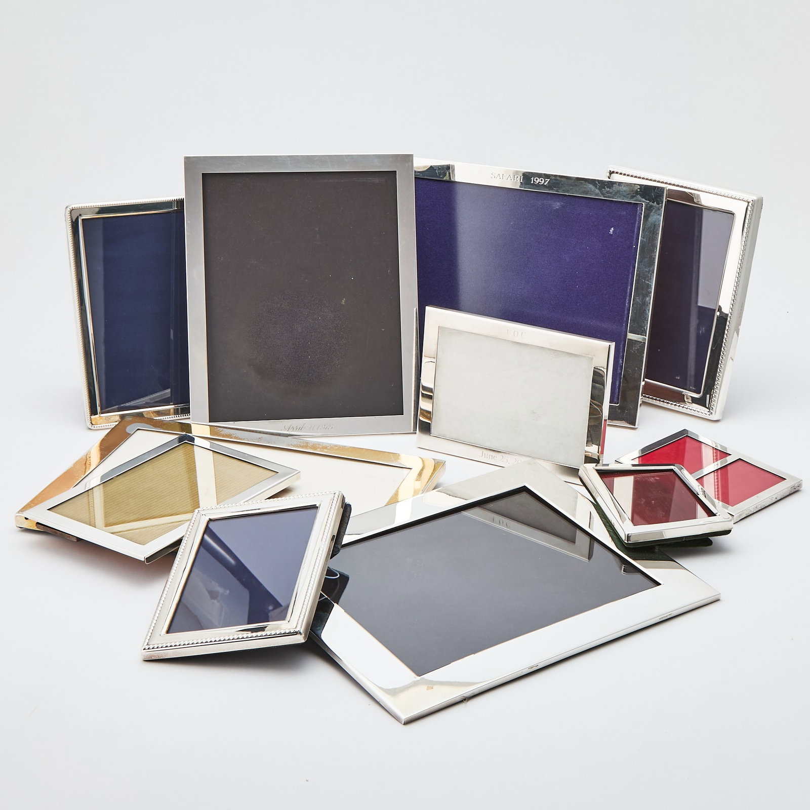Group of Eleven American and English Sterling Silver Photograph Frames: Various makers and sizes, inlcuding Tiffany & Co., Reed & Barton, Gorham, and Asprey. Height of largest 11 5/8 inches, width 9 5/8 inches.