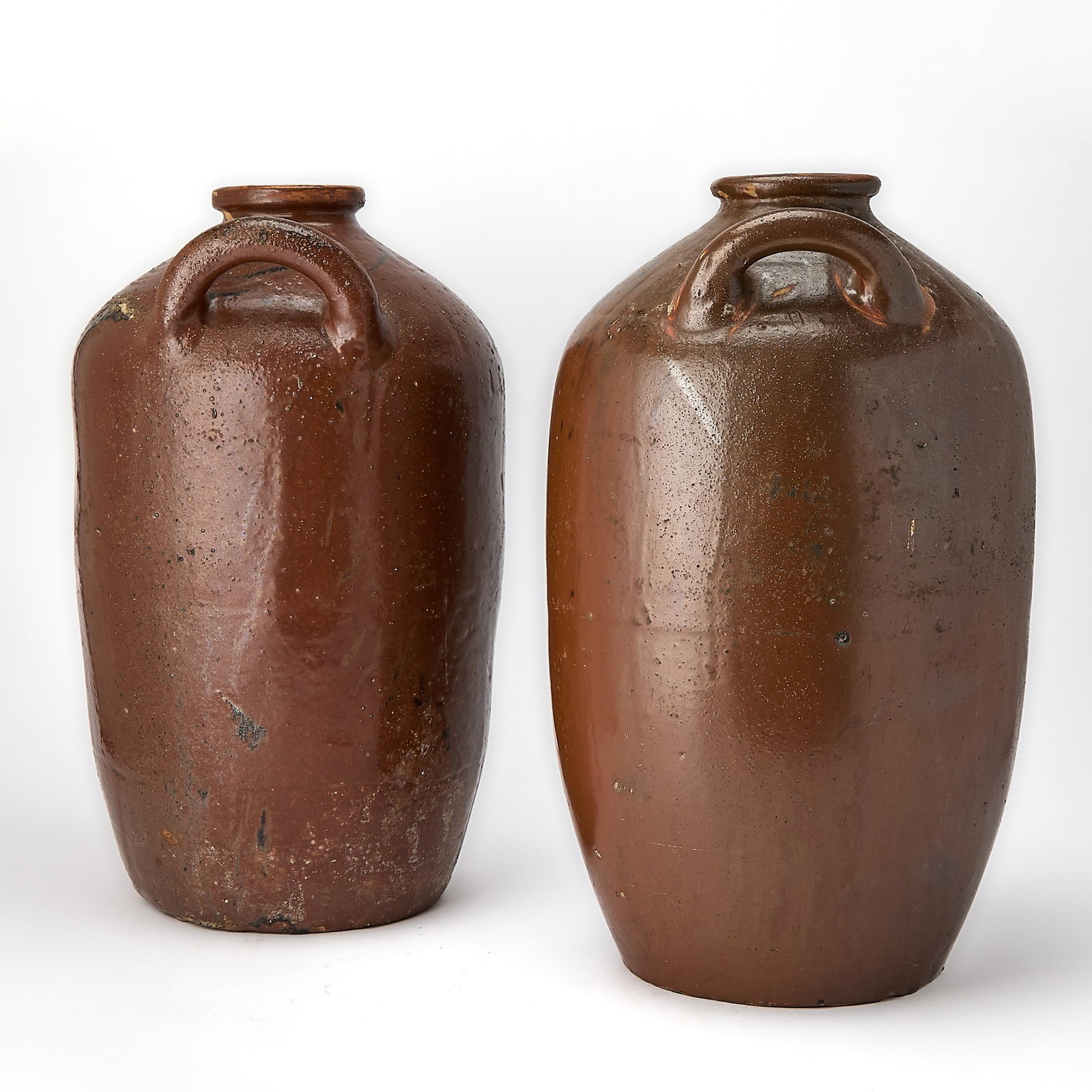 Pair of Italian Pottery Olive Oil Jars: Height 22 inches, diameter 12 inches.