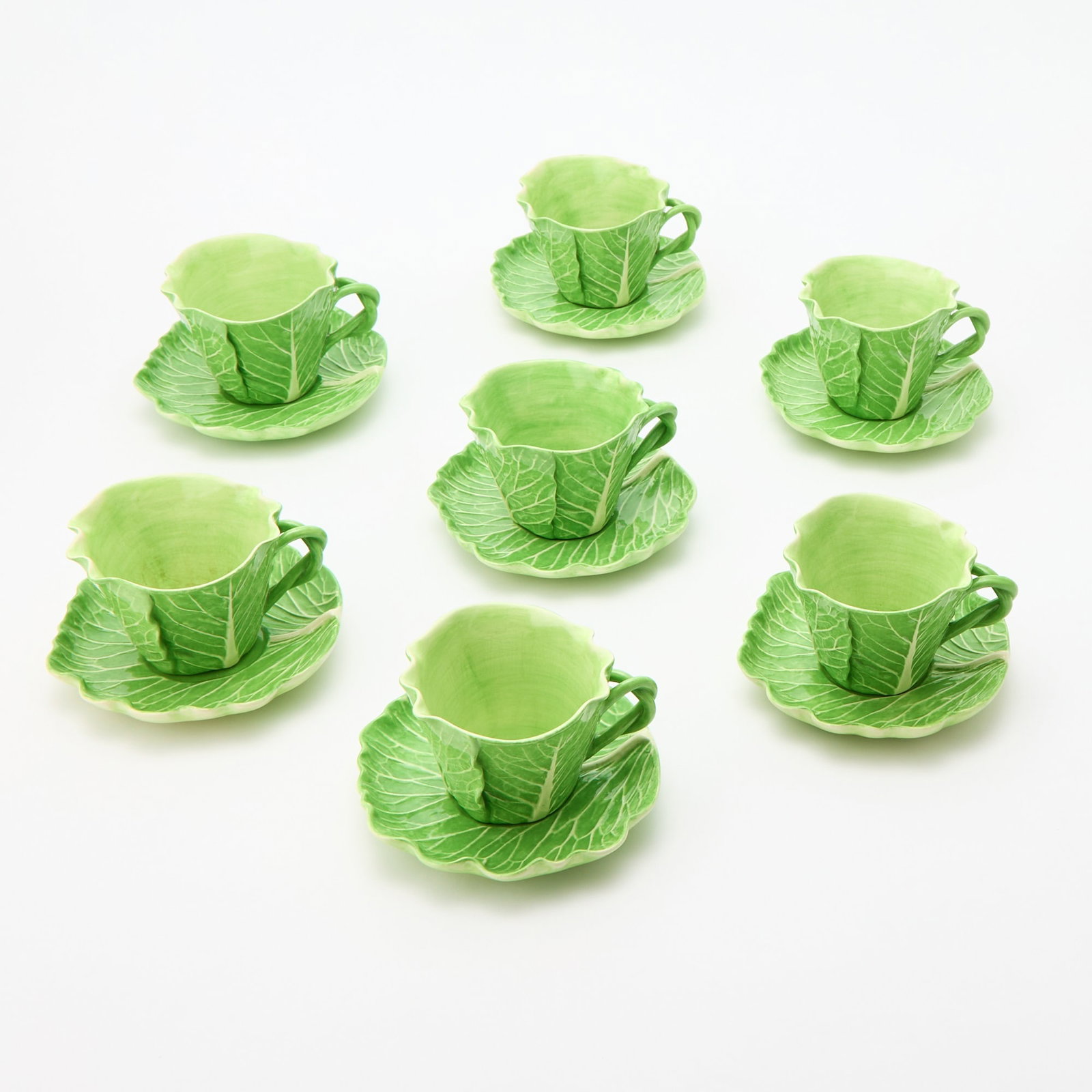 Group of Seven Dodi Thayer Green Glazed Earthenware "Lettuce Ware" Cups and Seven Saucers,: Height of cup 3 1/8 inches; width of saucer 6 1/4 inches.